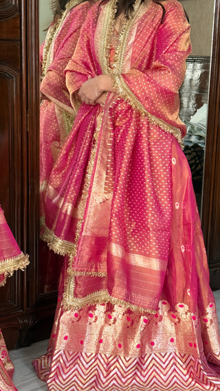 “Kali wala lahenga” — Rani pink semi stitched banarasi tissue silk lehenga set