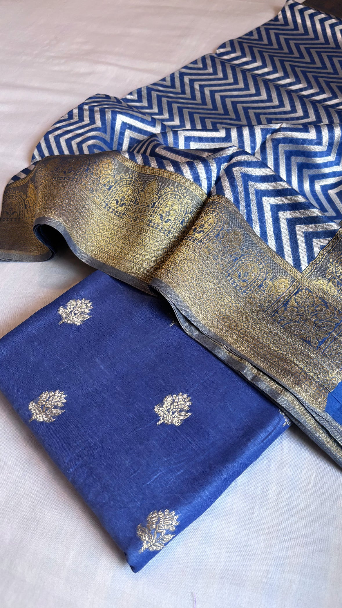 Ink blue linen kurta paired with kora silk chevron duppata and bottom suit set