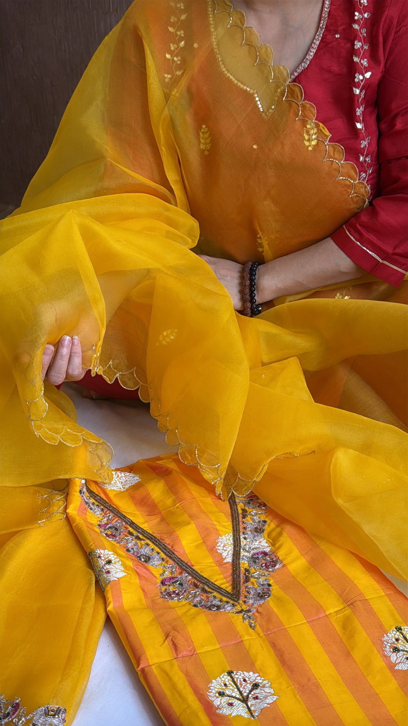 Haldi yellow-orange dhup chao effect katan silk striped kurta paired with kora silk scalloped duppata set
