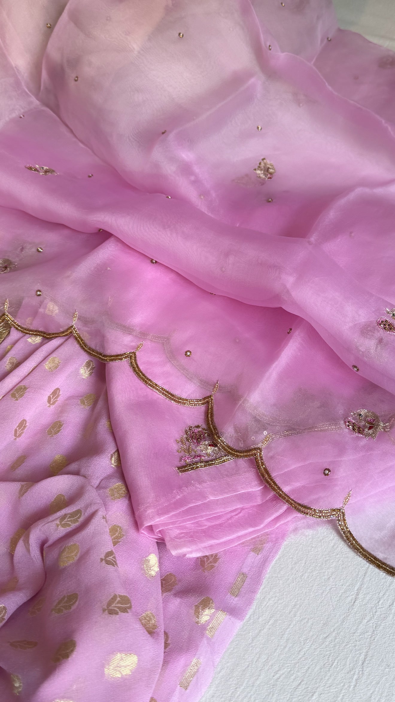 Blush pink banarasi gorgette kadhwa buti kurta paired with toy hathi motif hand embroidered scalloped kora duppata