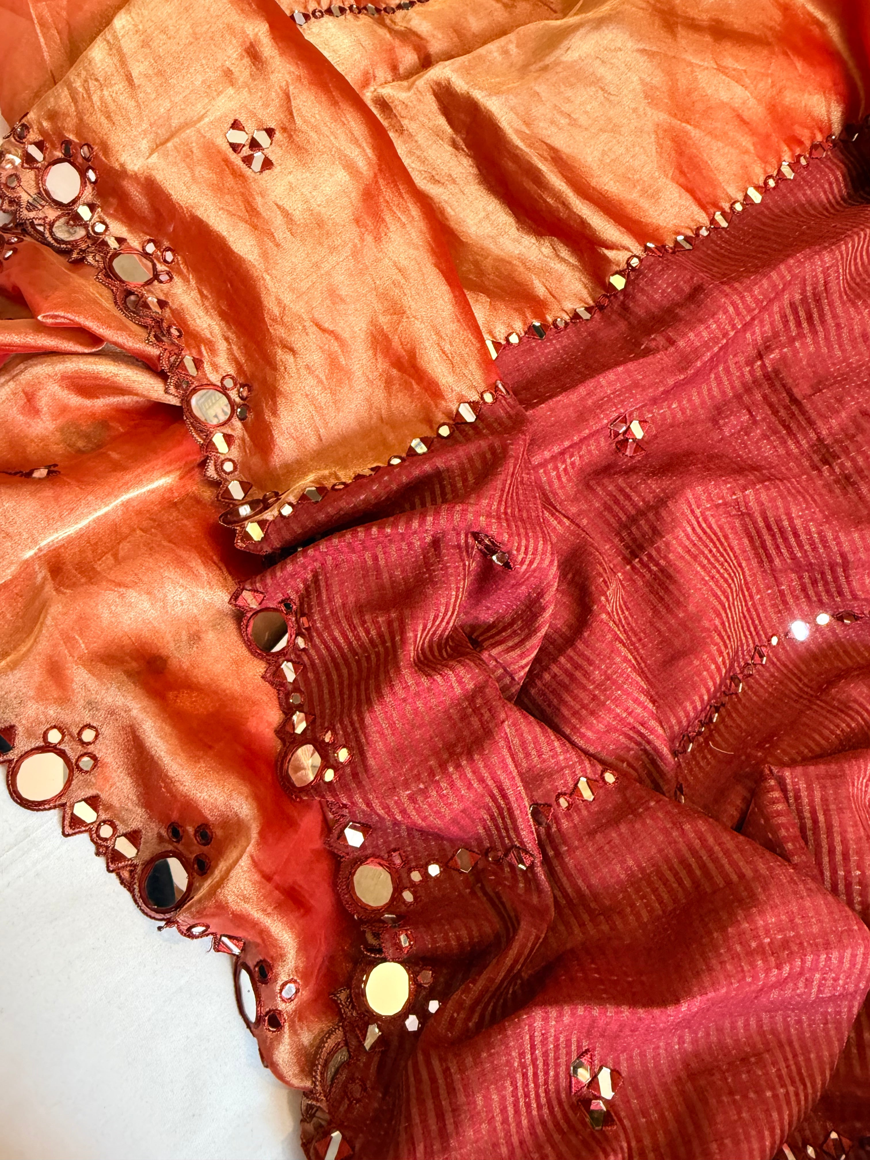 Rustic red half striped-half tissue mirror work hand embroidered kadhwa saree