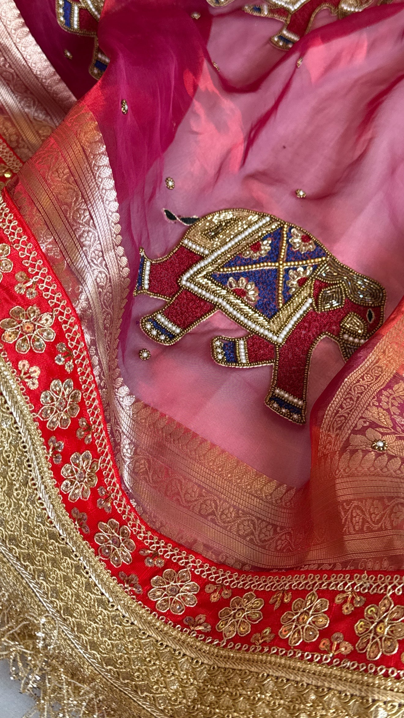 Elephant motif cranberry metallic red husn tissue silk hand embroidered saree