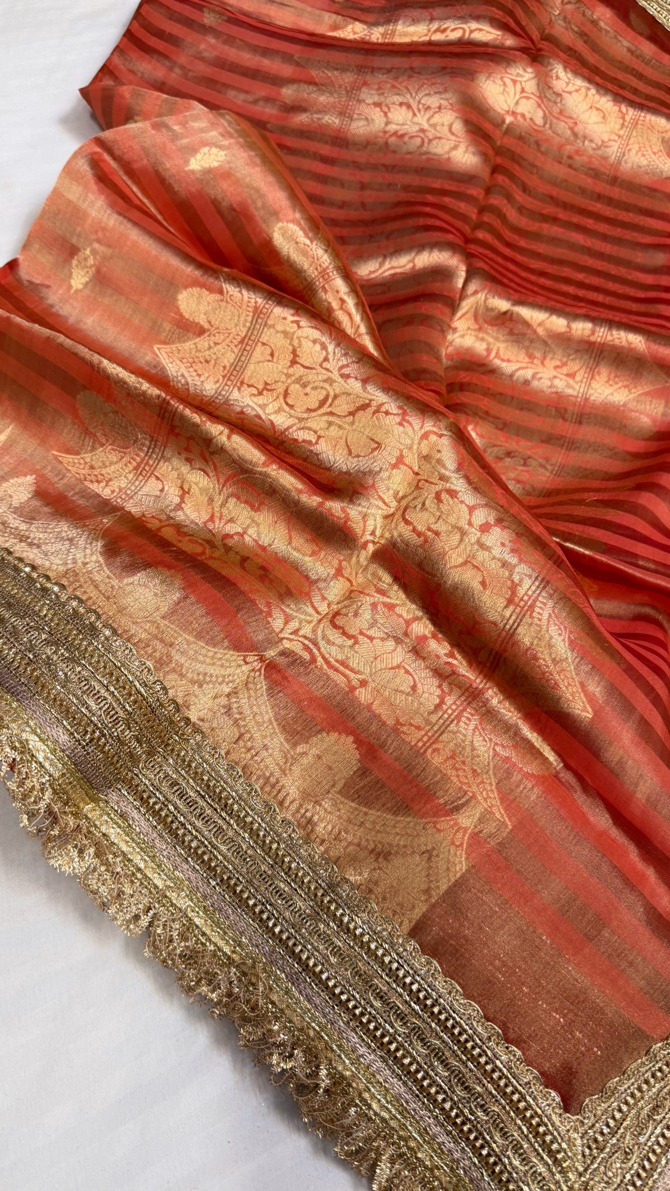 Maharani rust red tissue silk striped kadhwa saree