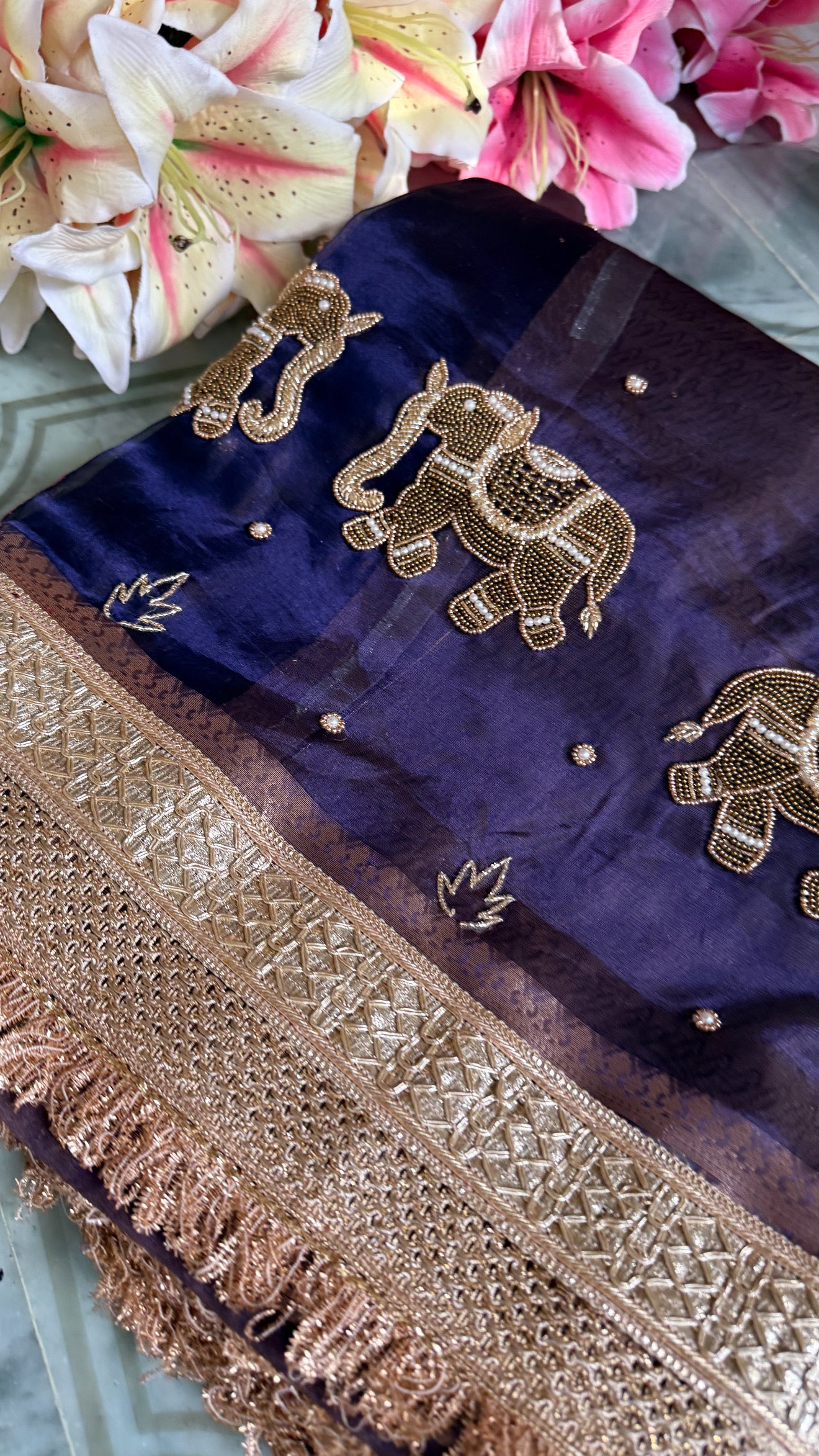 Husn midnight blue tissue silk hand embroidered elephant motif saree