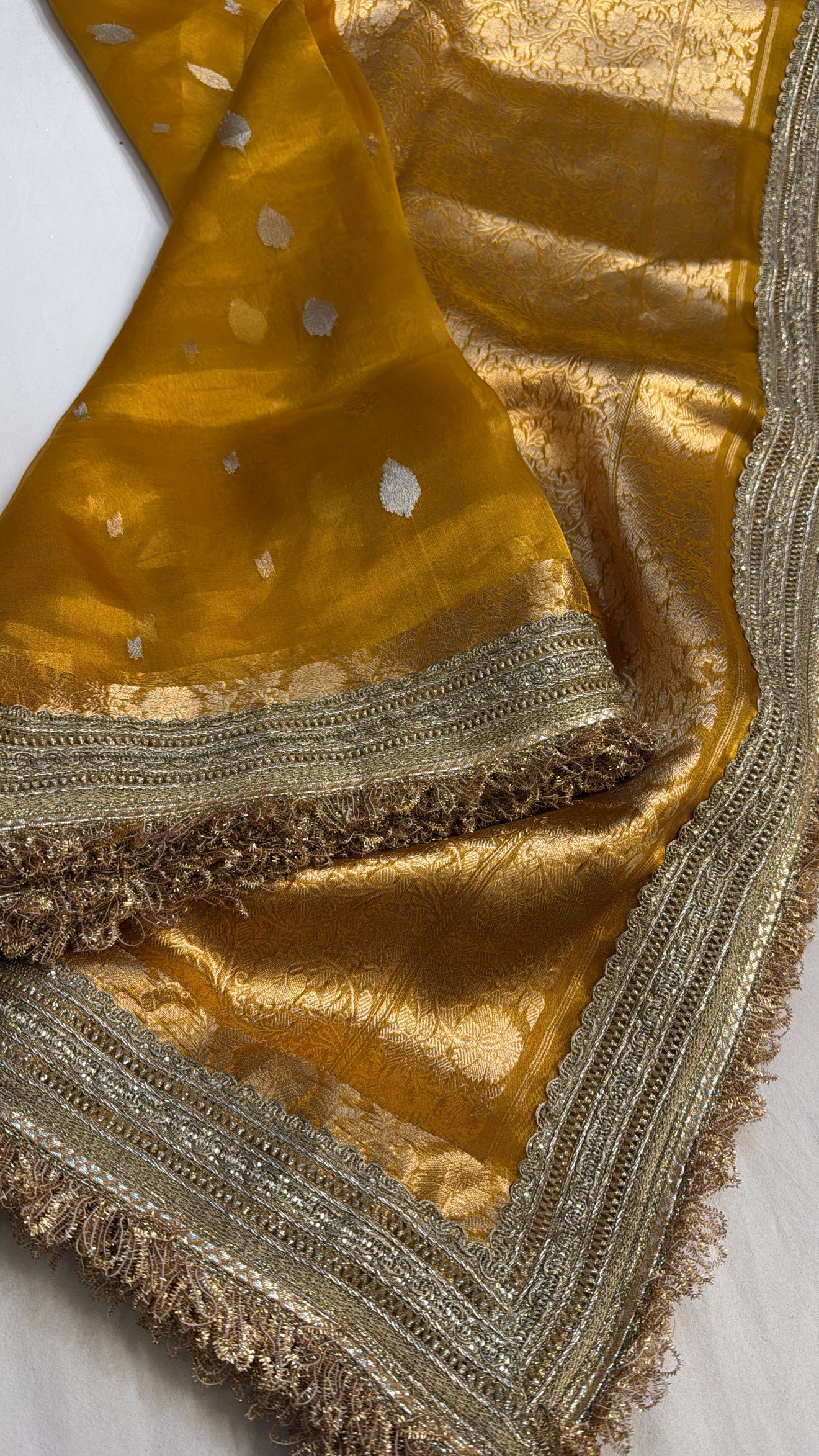 Maharani deep haldi yellow tissue silk kadhwa buti saree