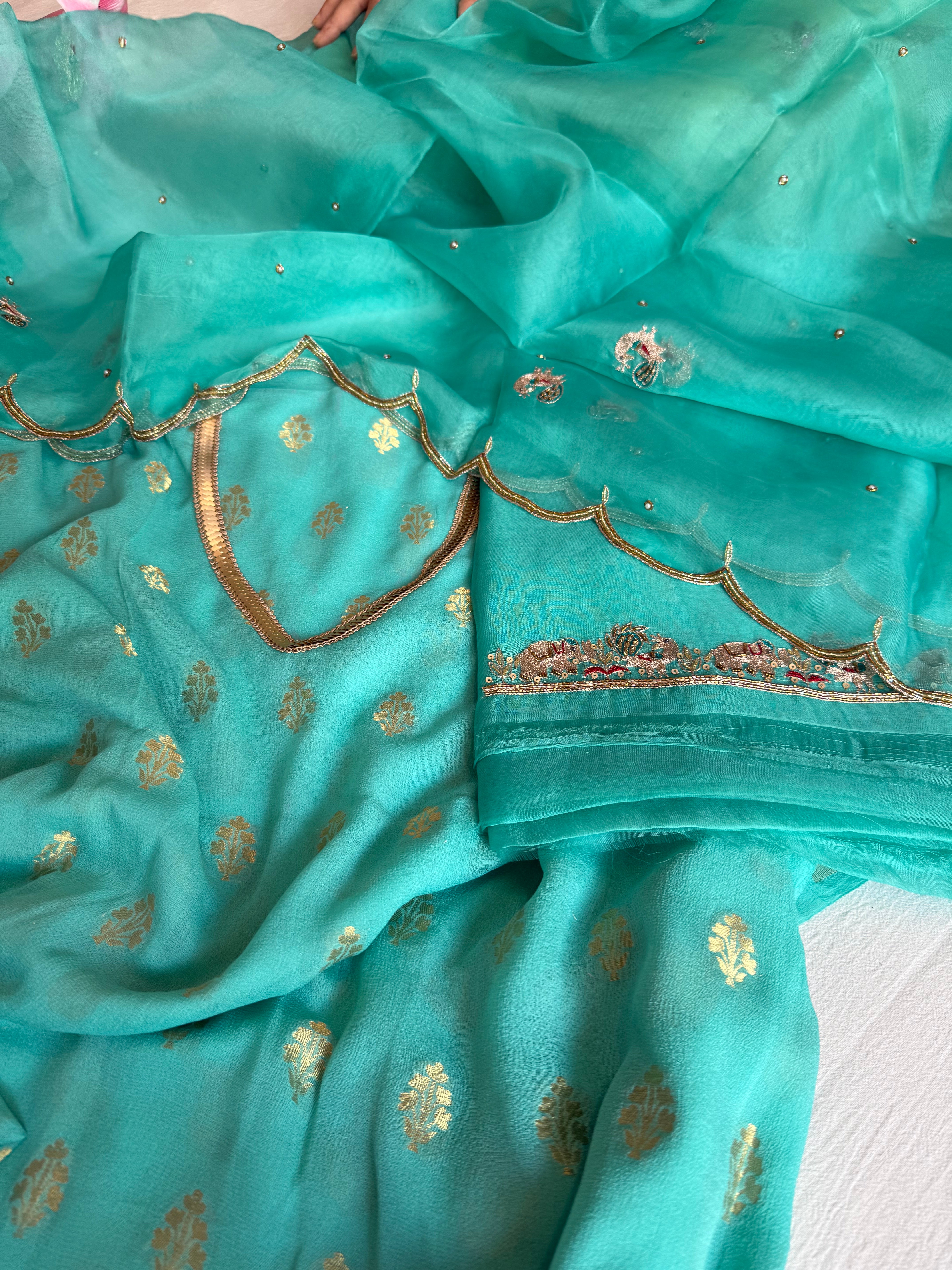 Rama blue banarasi gorgette kadhwa buti kurta paired with toy hathi motif hand embroidered scalloped duppata