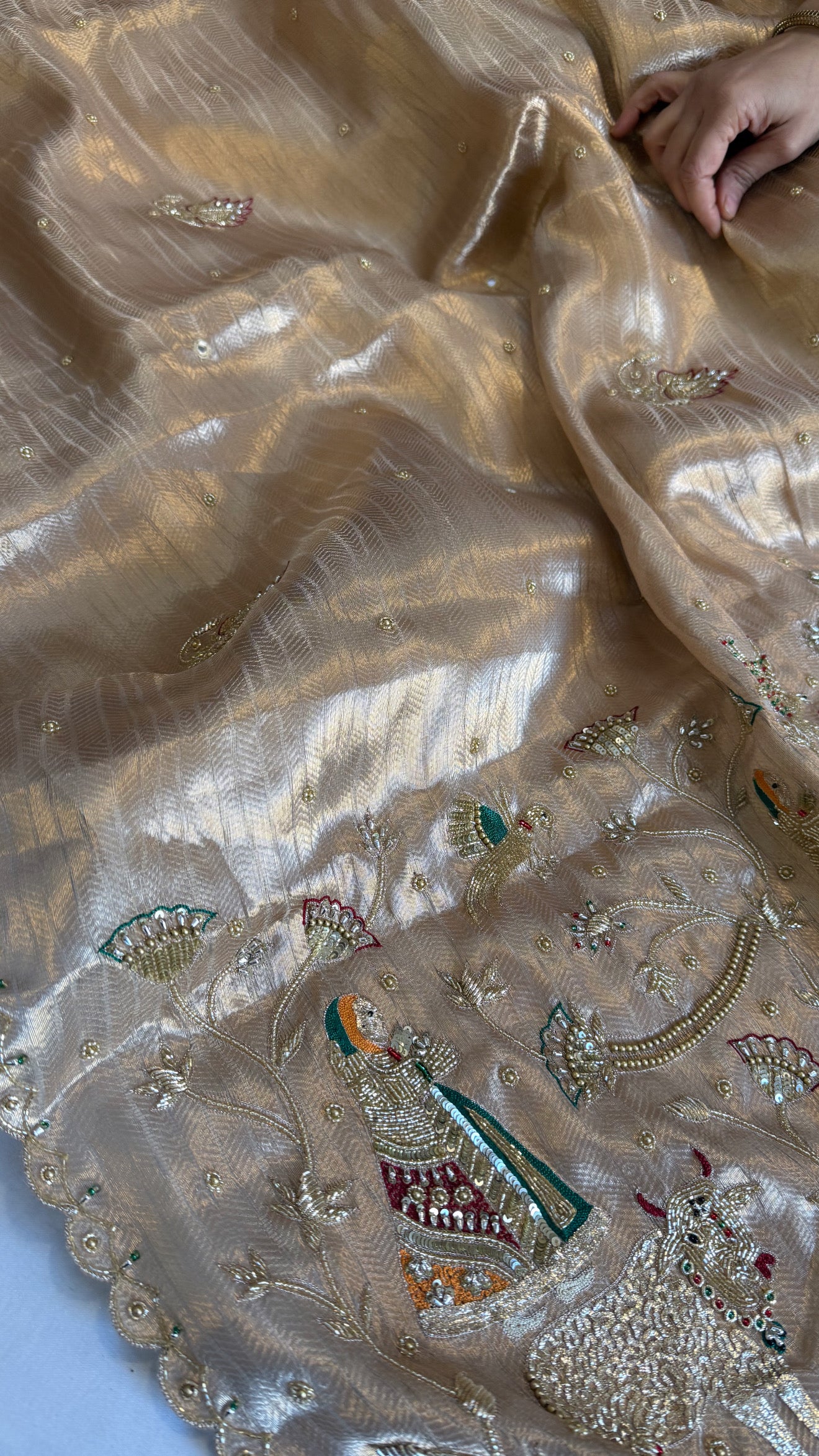 Shrinathji motif inspired molten tissue brocade kadhwa weaving hand embroidered saree