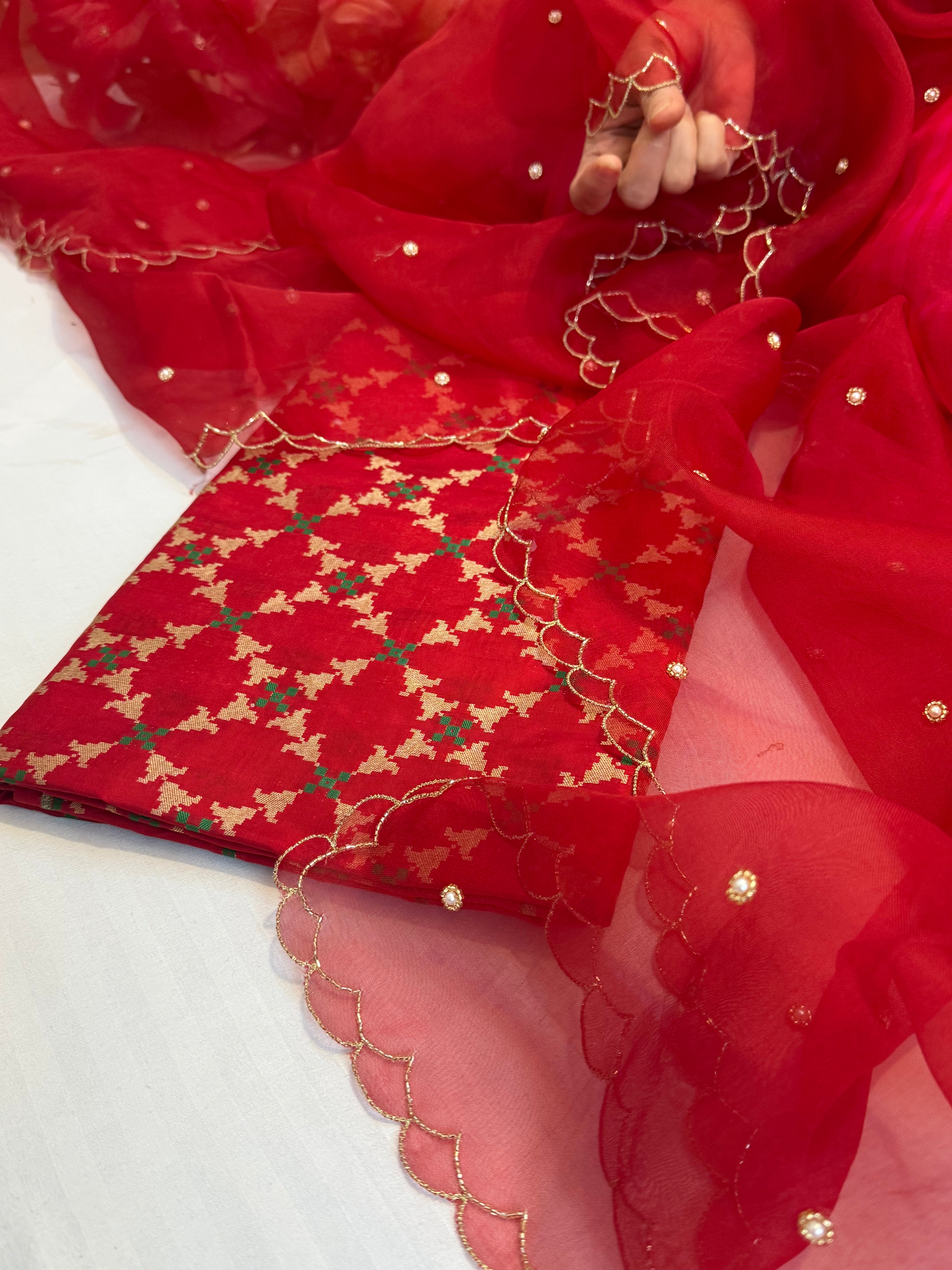 Blood red katan silk patola weaving kurta paired with kora silk scalloped duppata set