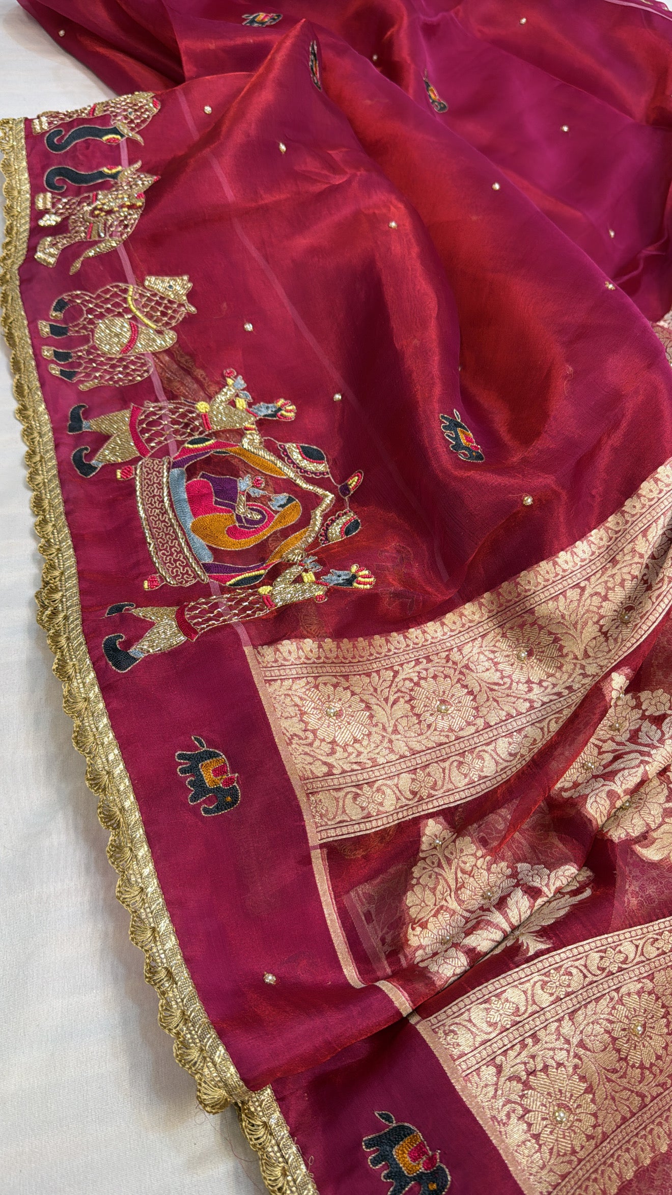 Husn metallic cherry red tissue silk hand embroidered saree