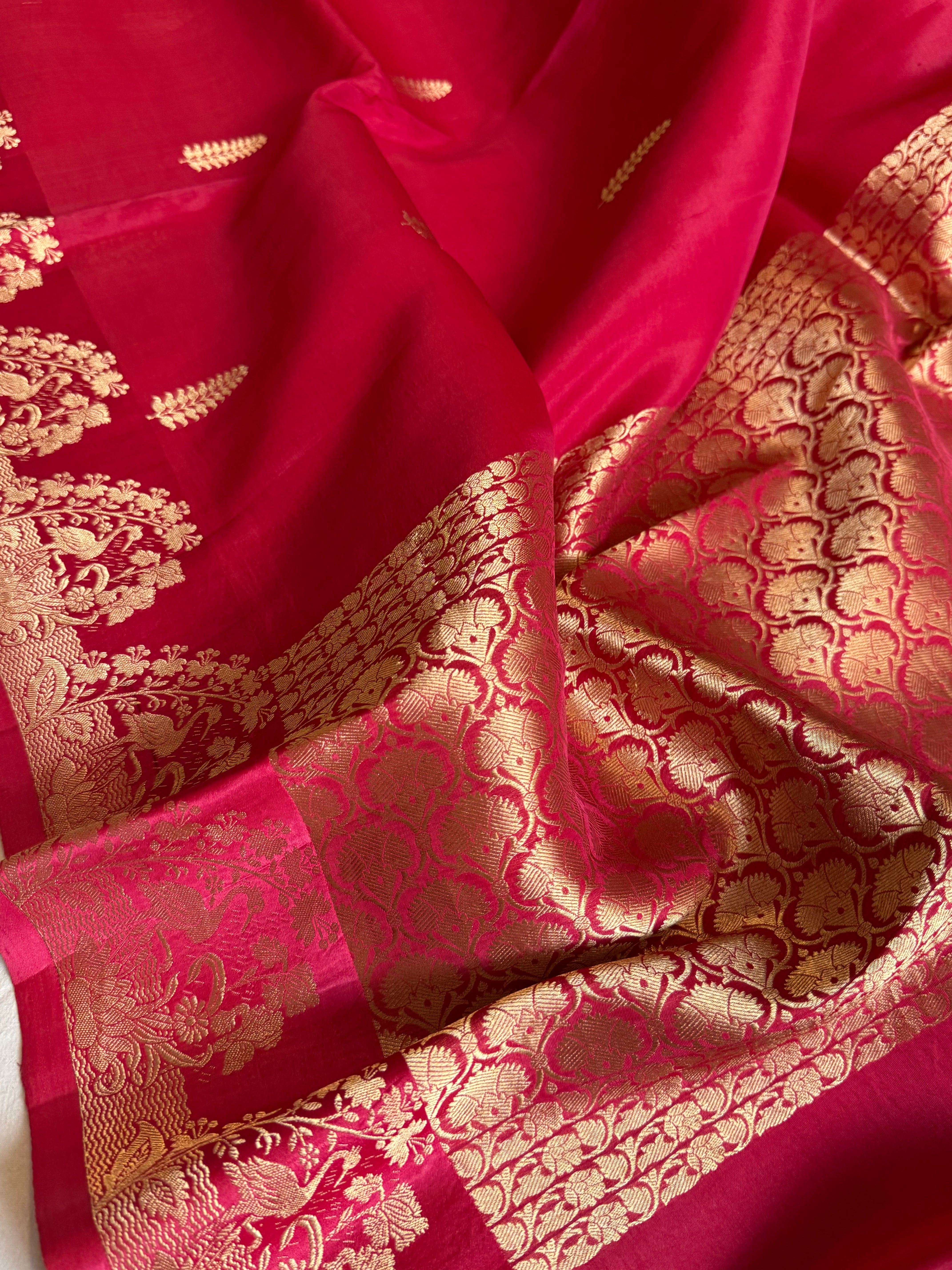 Rani pink banarasi kora silk hand embroidered kadhwa saree