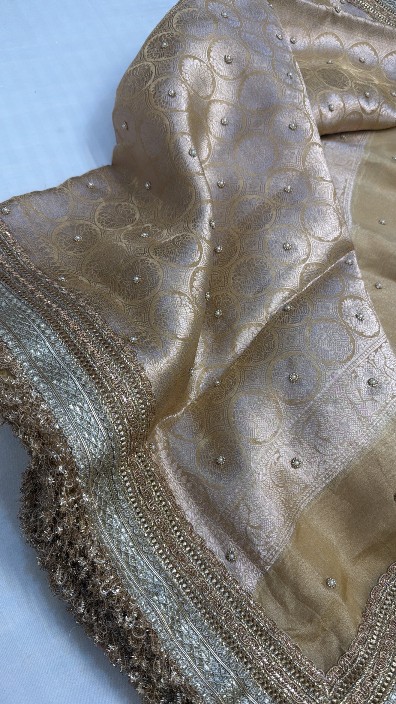 Husn champagne gold tissue silk hand embroidered saree