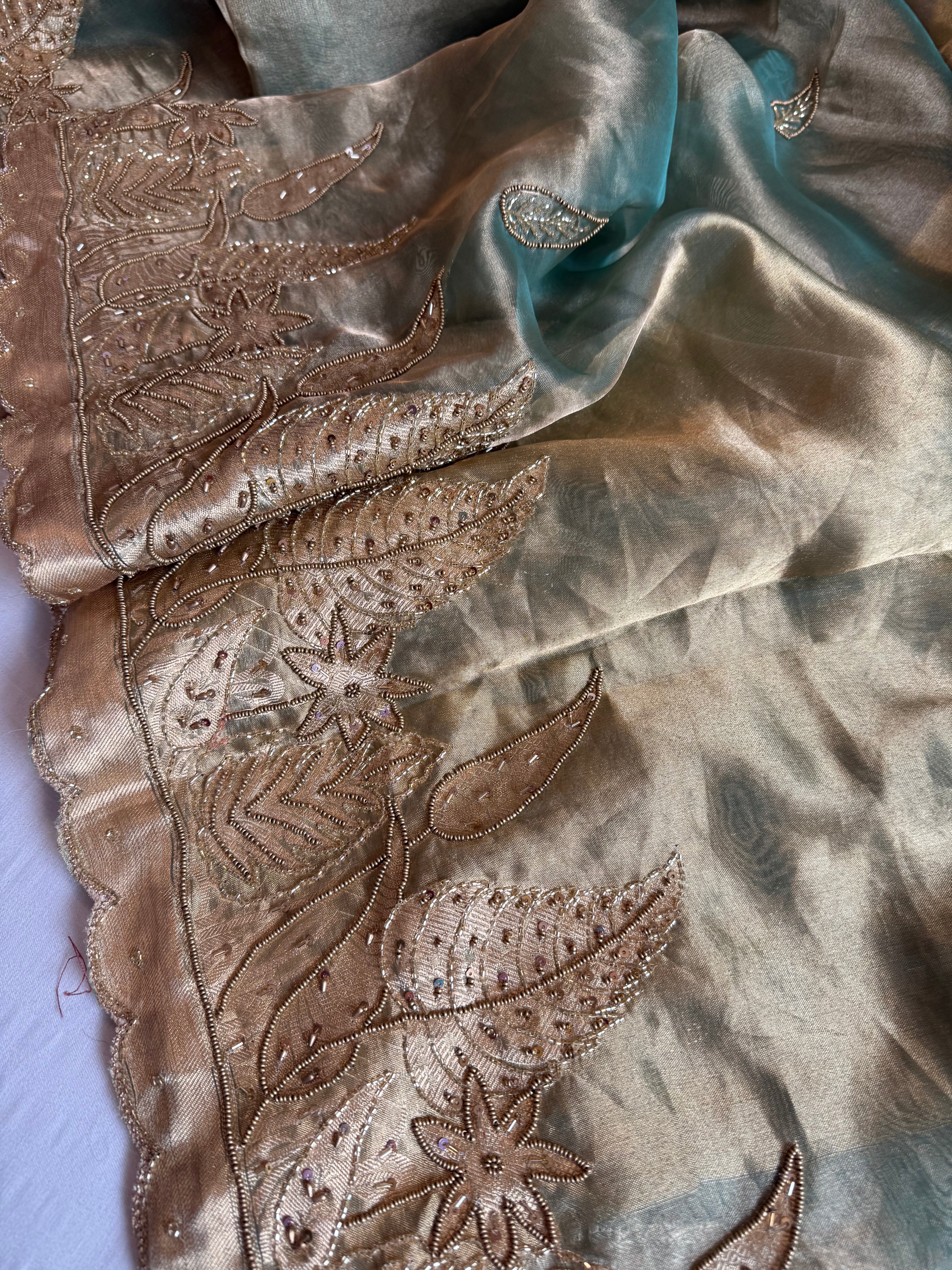 Husn candy green tissue silk heavy hand embroidered saree