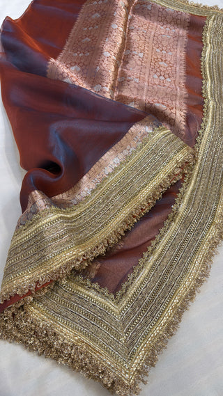 Maharani metallic maroonish-blue dhup chao effect tissue silk saree