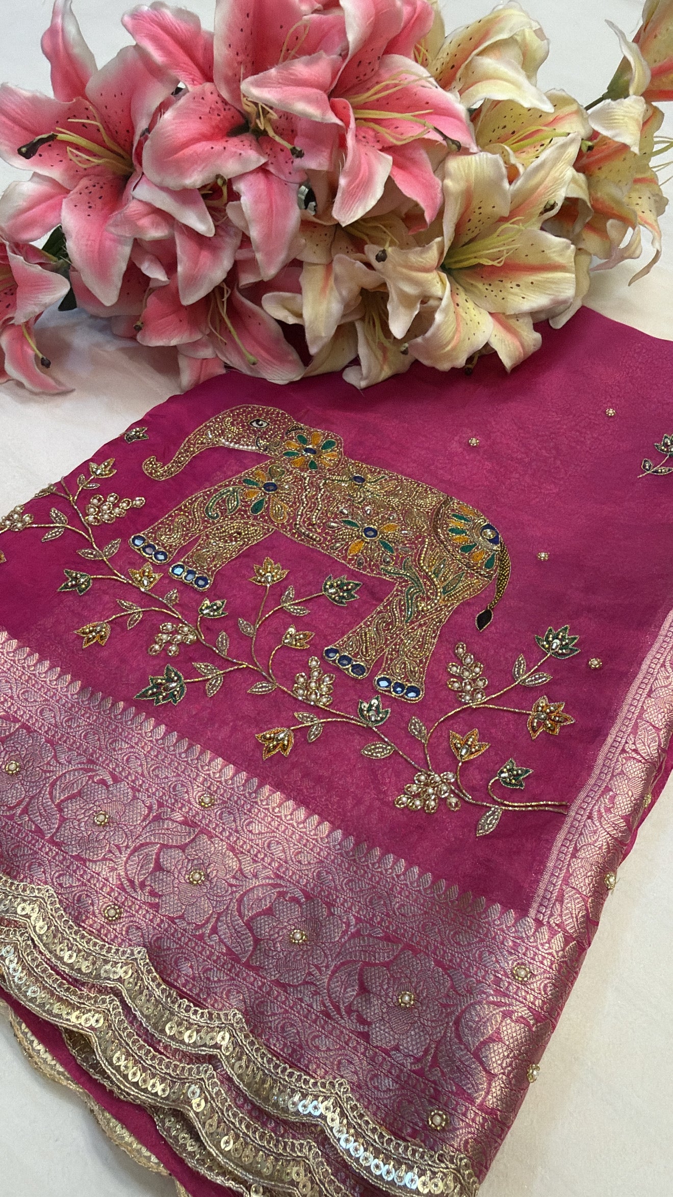 Rani pink husn tissue silk elephant motif hand embroidered saree