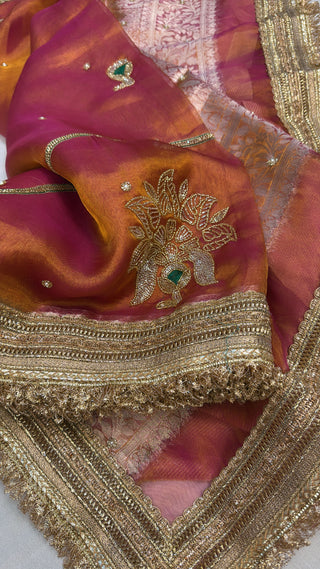 Husn pinkish-orange dhup chao effect tissue silk hand embroidered saree