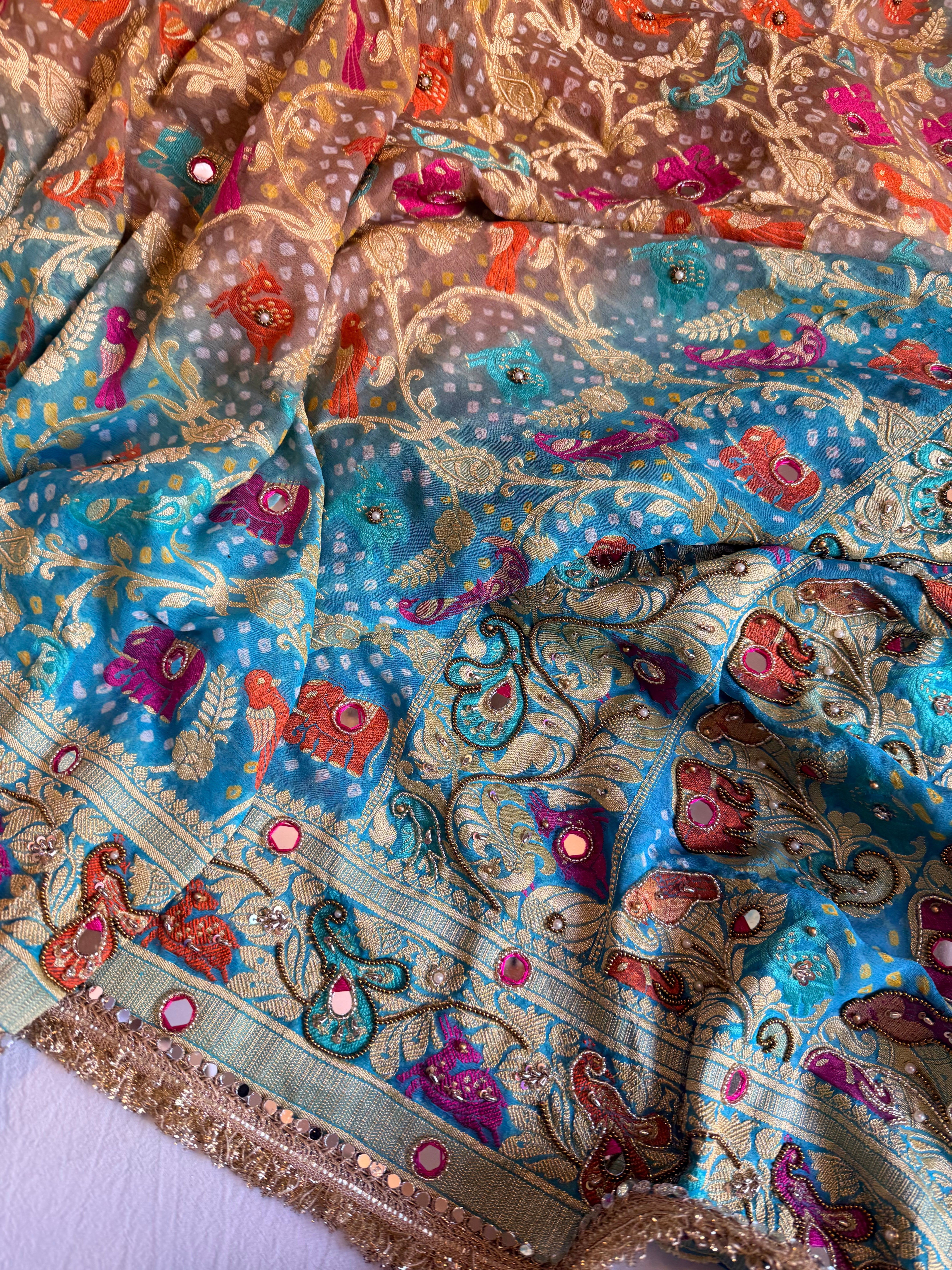 Banarasi blush shades of chiffon rai bandhej mirror work hand embroidered saree