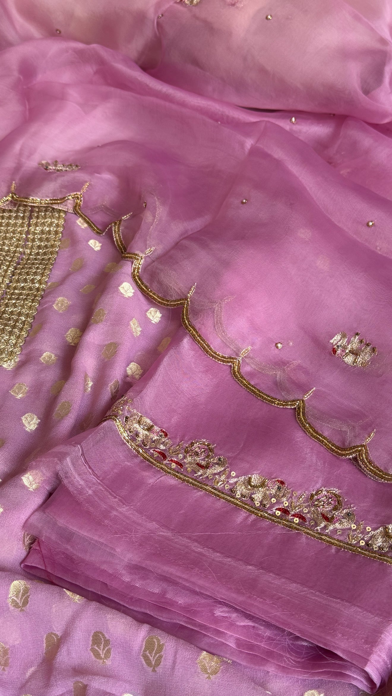 Dusty pink banarasi gorgette kadhwa buti kurta paired with toy hathi motif hand embroidered scalloped kora duppata