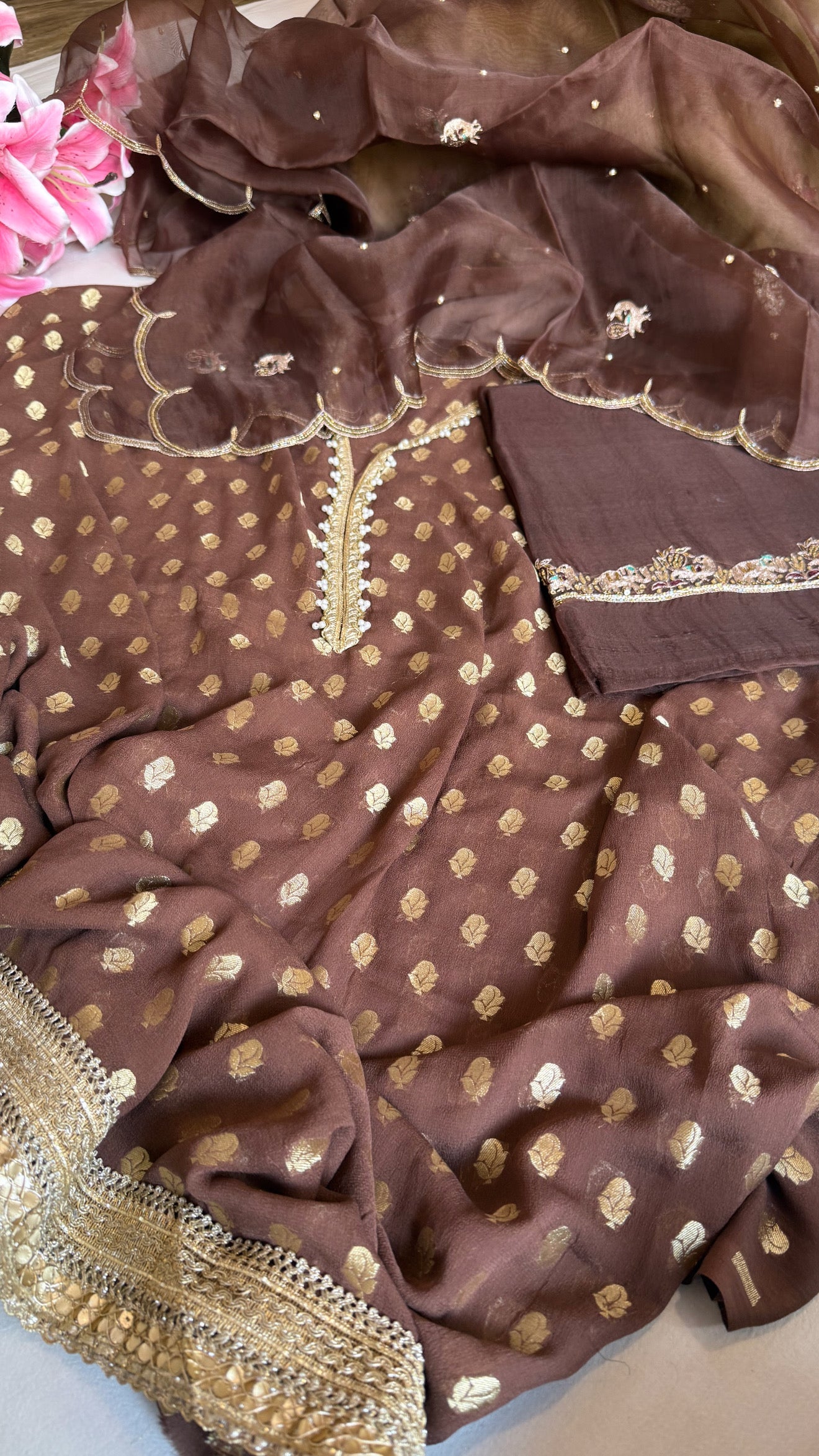 Choco brown banarasi gorgette kadhwa buti kurta paired with toy hathi motif hand embroidered scalloped kora duppata