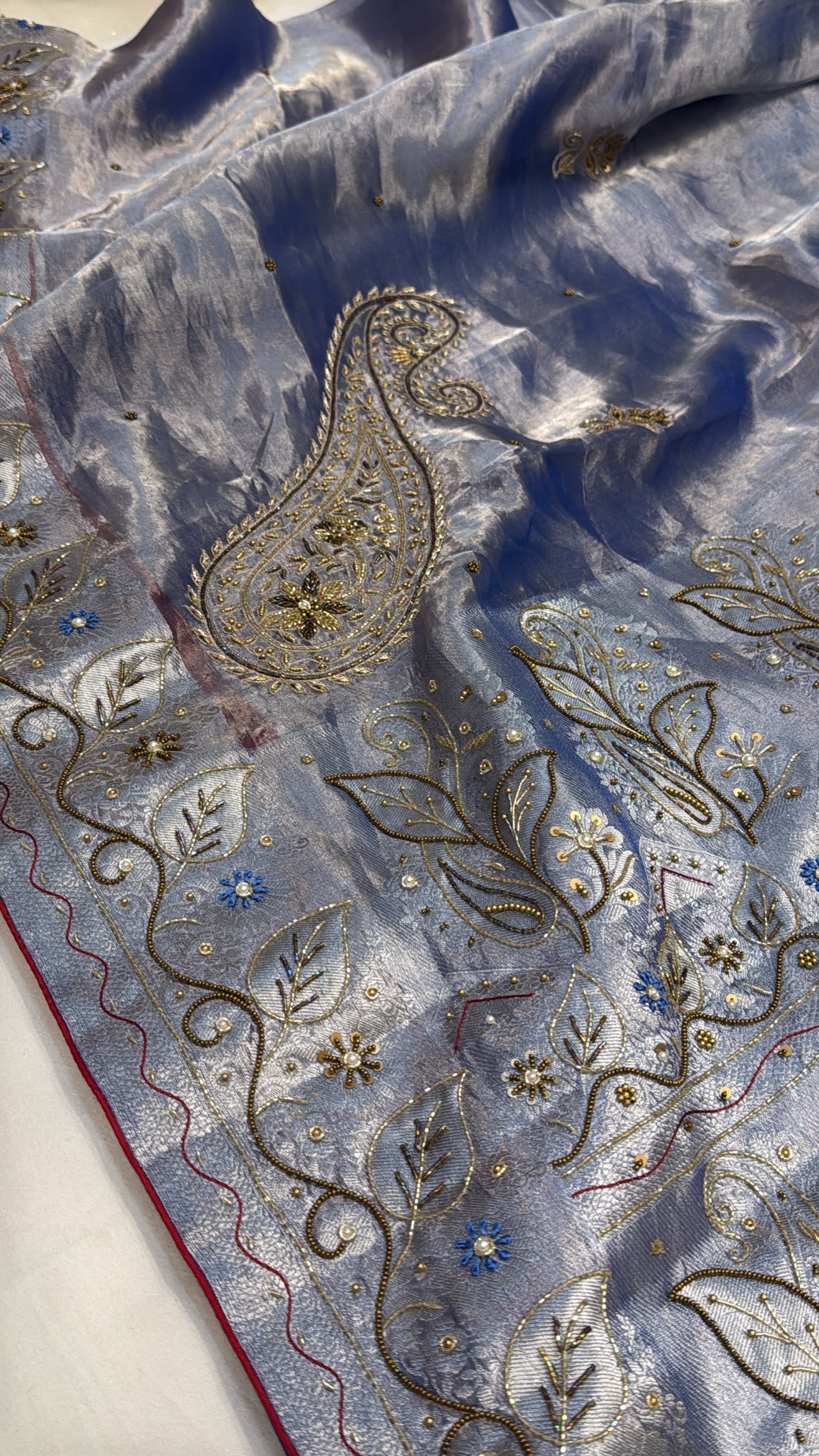 Persian blue husn tissue silk carry motif hand embroidered saree