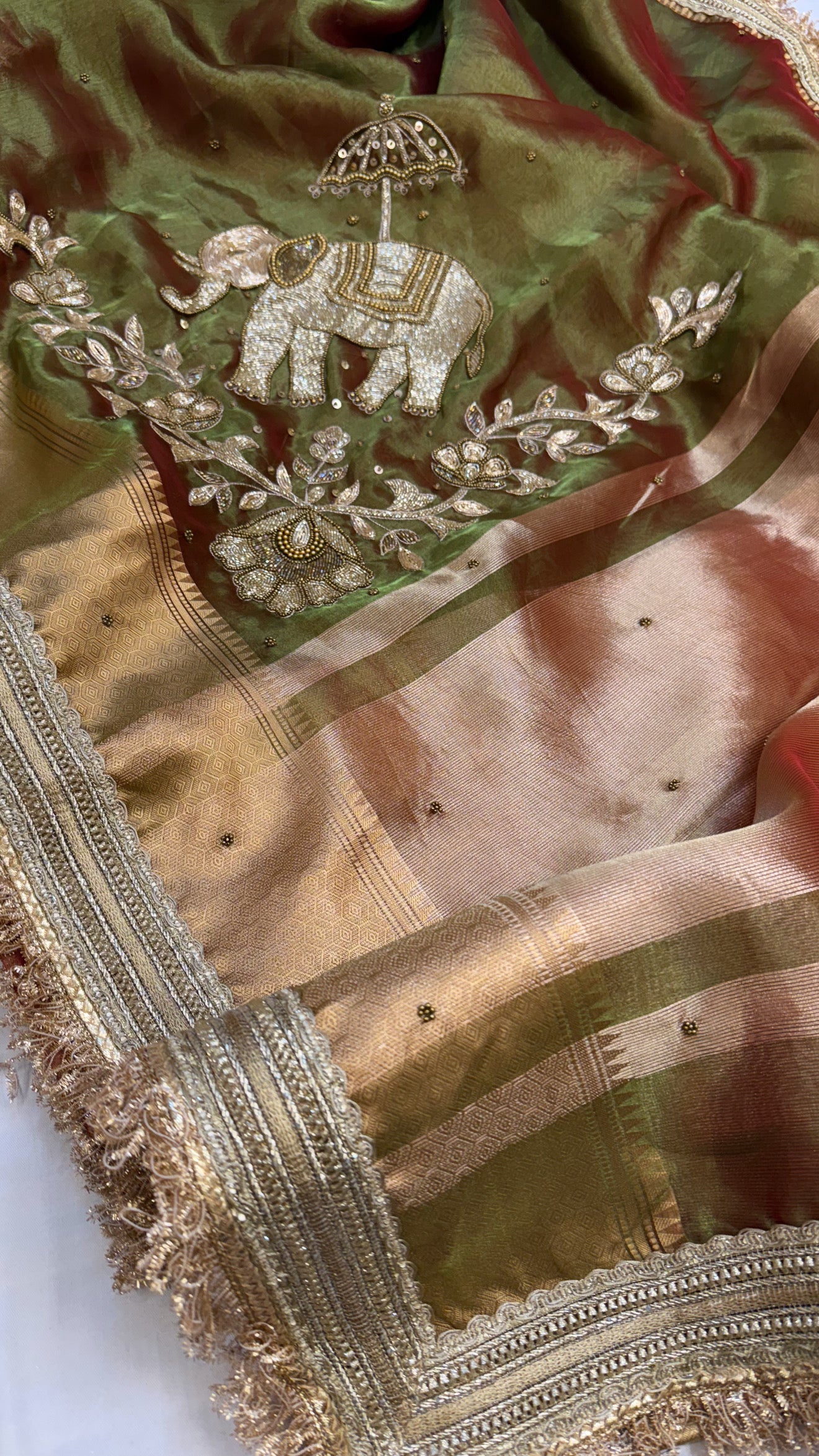 Dulhan ki maa wali sarees - Mehendi green elephant motif hand embroidered tissue saree