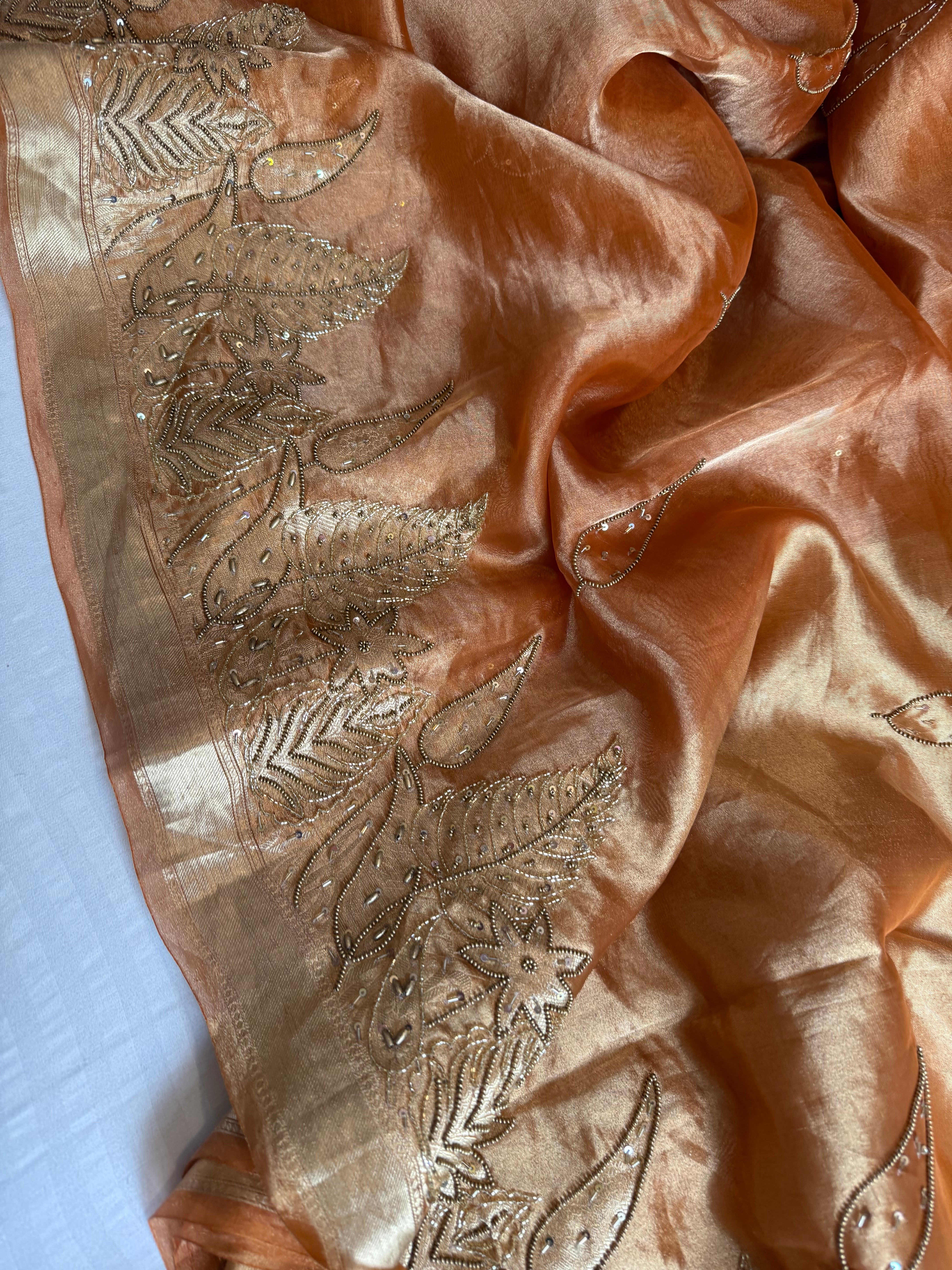 Husn tangerine red tissue silk heavy hand embroidered saree