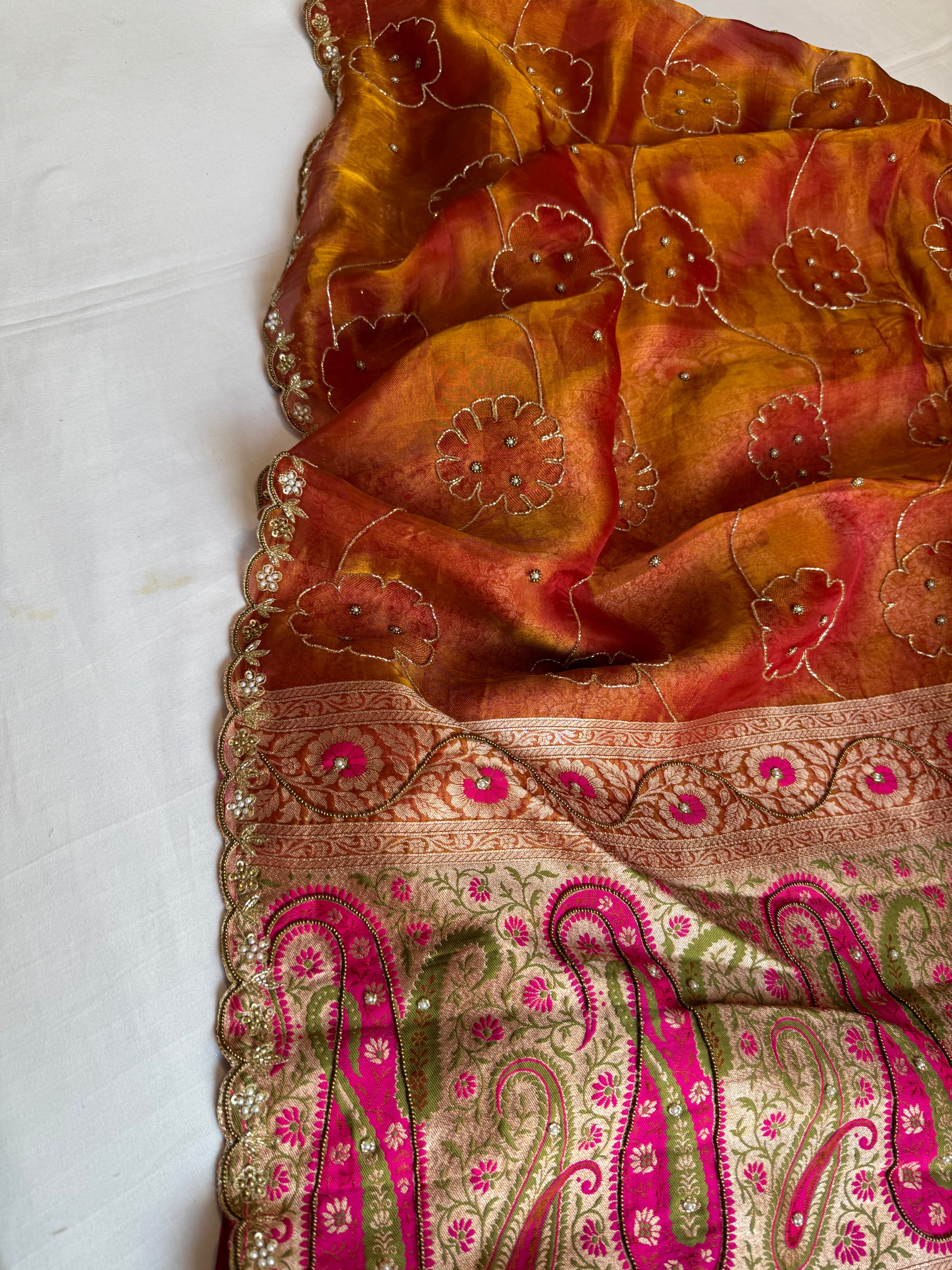 Rust orange tissue tanchoi jamevar pallu meenakari work hand embroidered saree