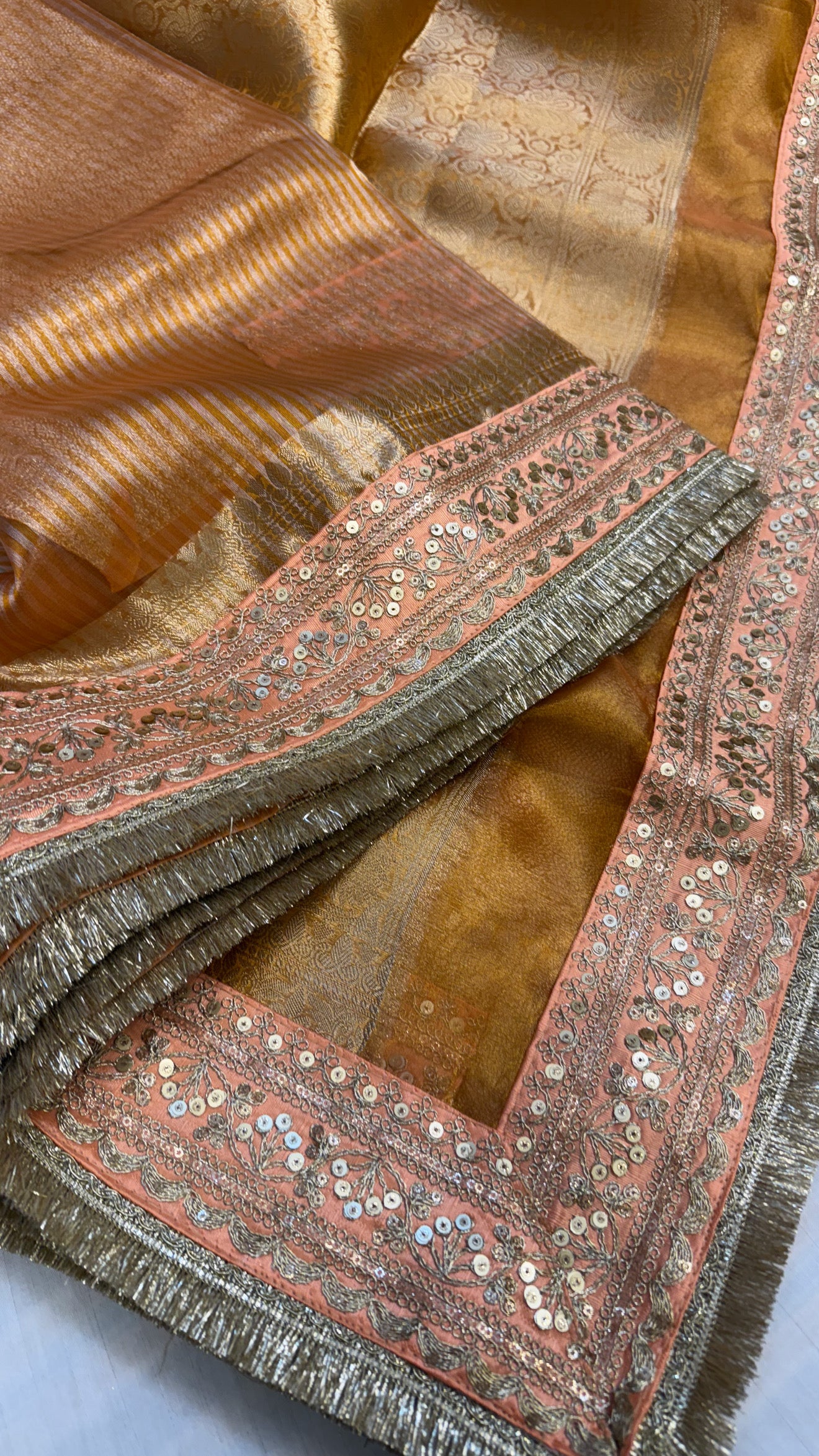 Chuski orange maharani tissue silk striped meenakari border saree