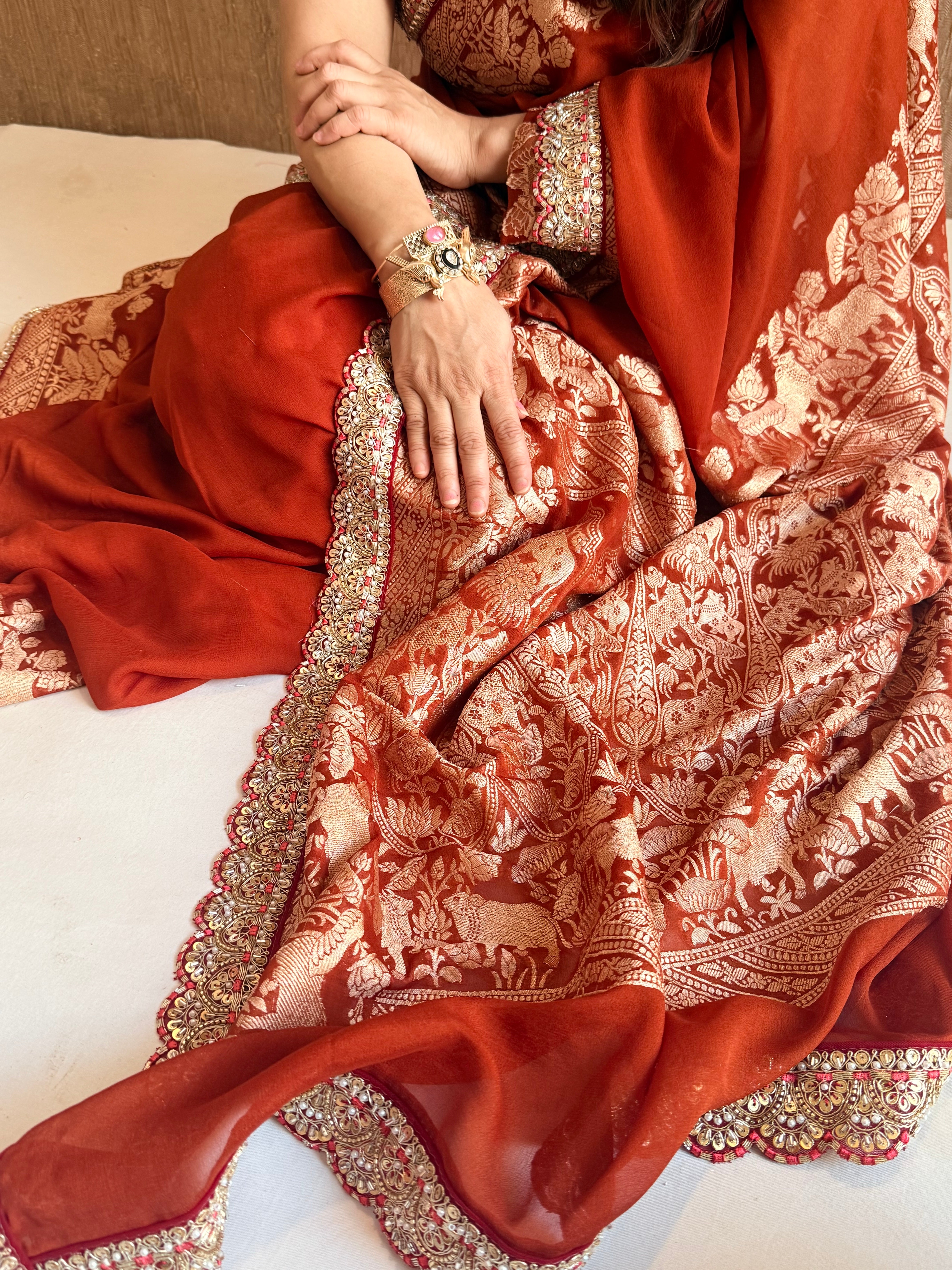Brick red shikargah kadhwa border chiffon gorgette banarasi saree