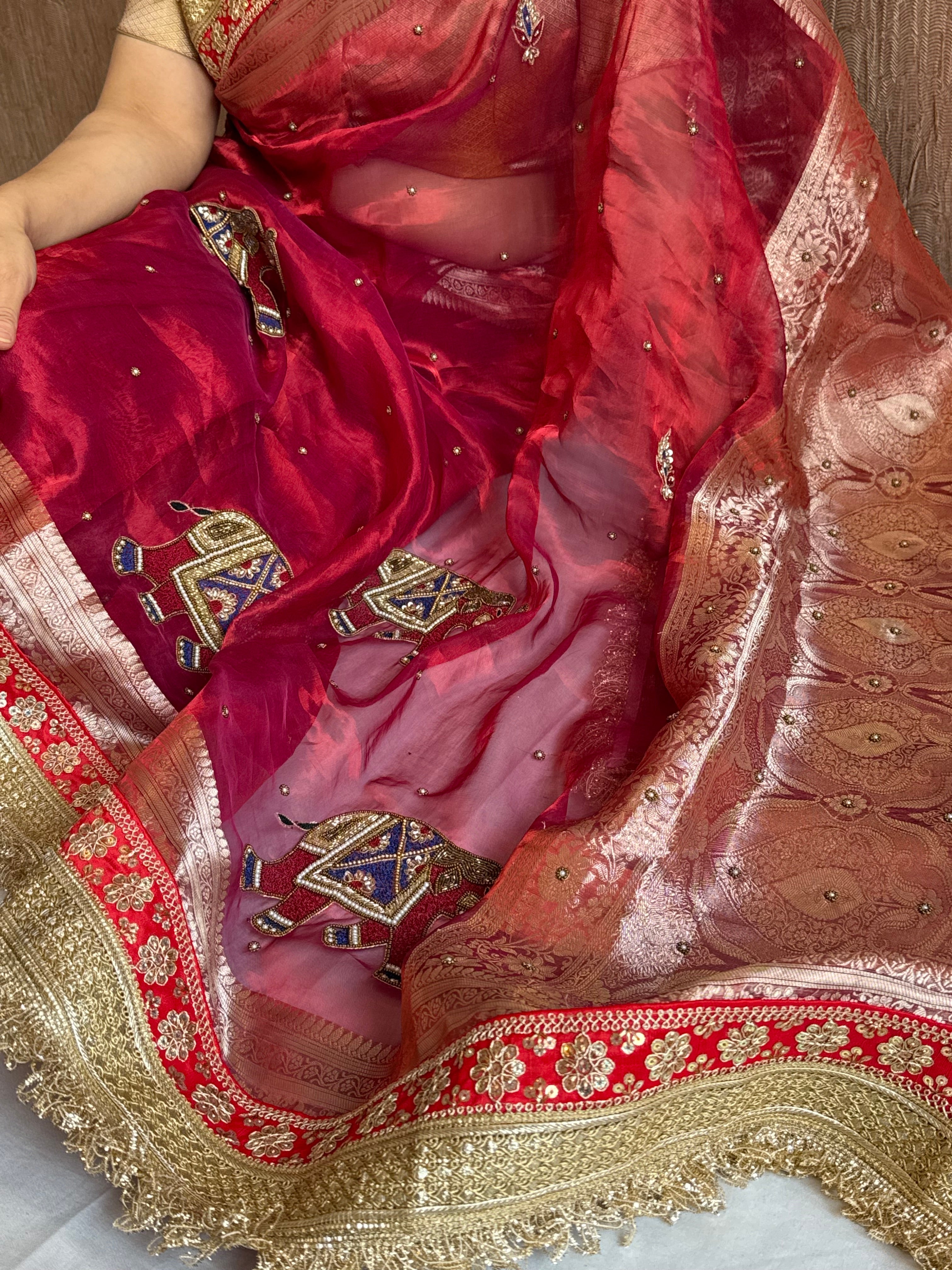 Elephant motif cranberry metallic red husn tissue silk hand embroidered saree