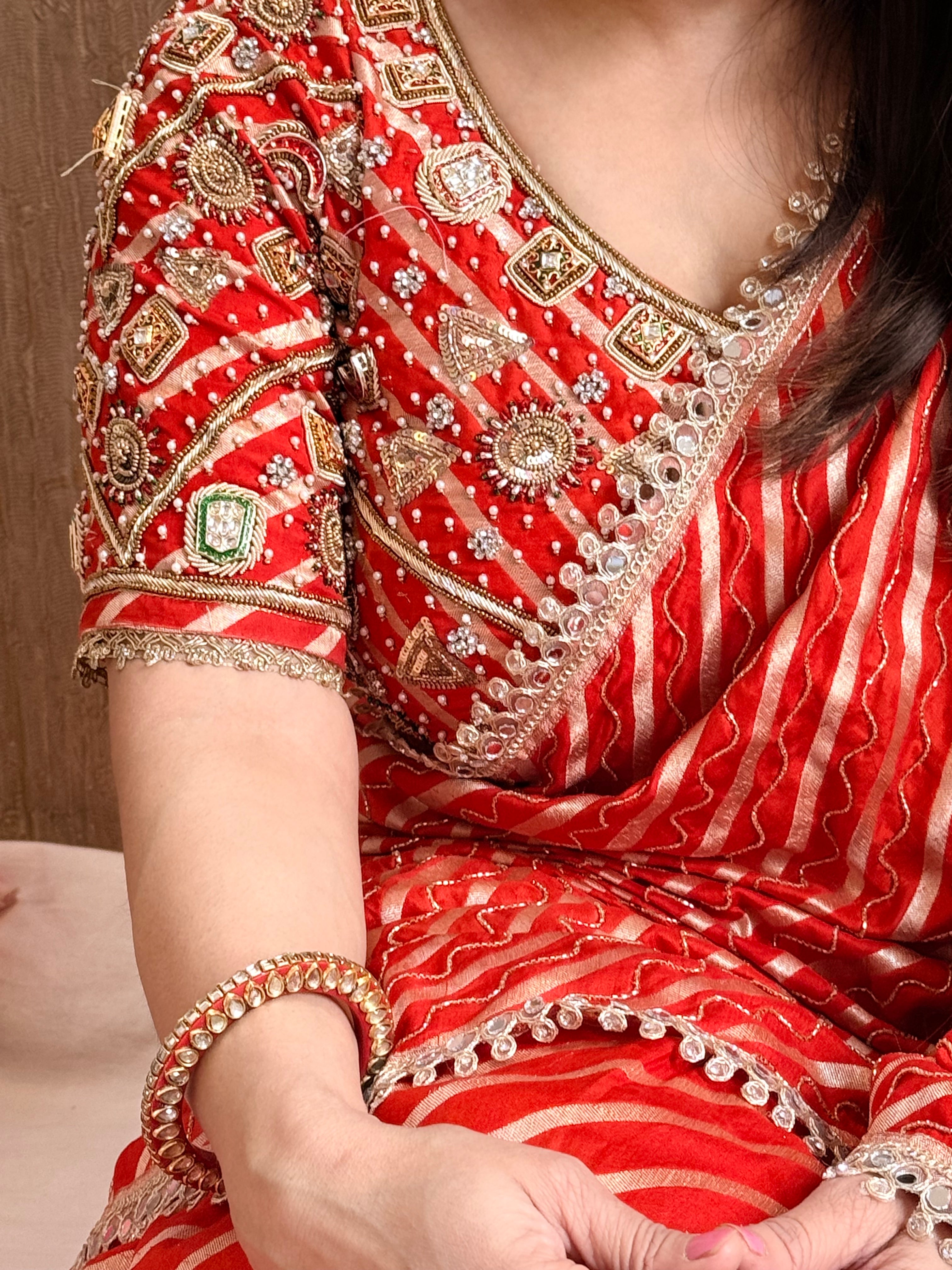 Mashru silk fresh orange leheriya hand embroidered saree with bejewelled blouse