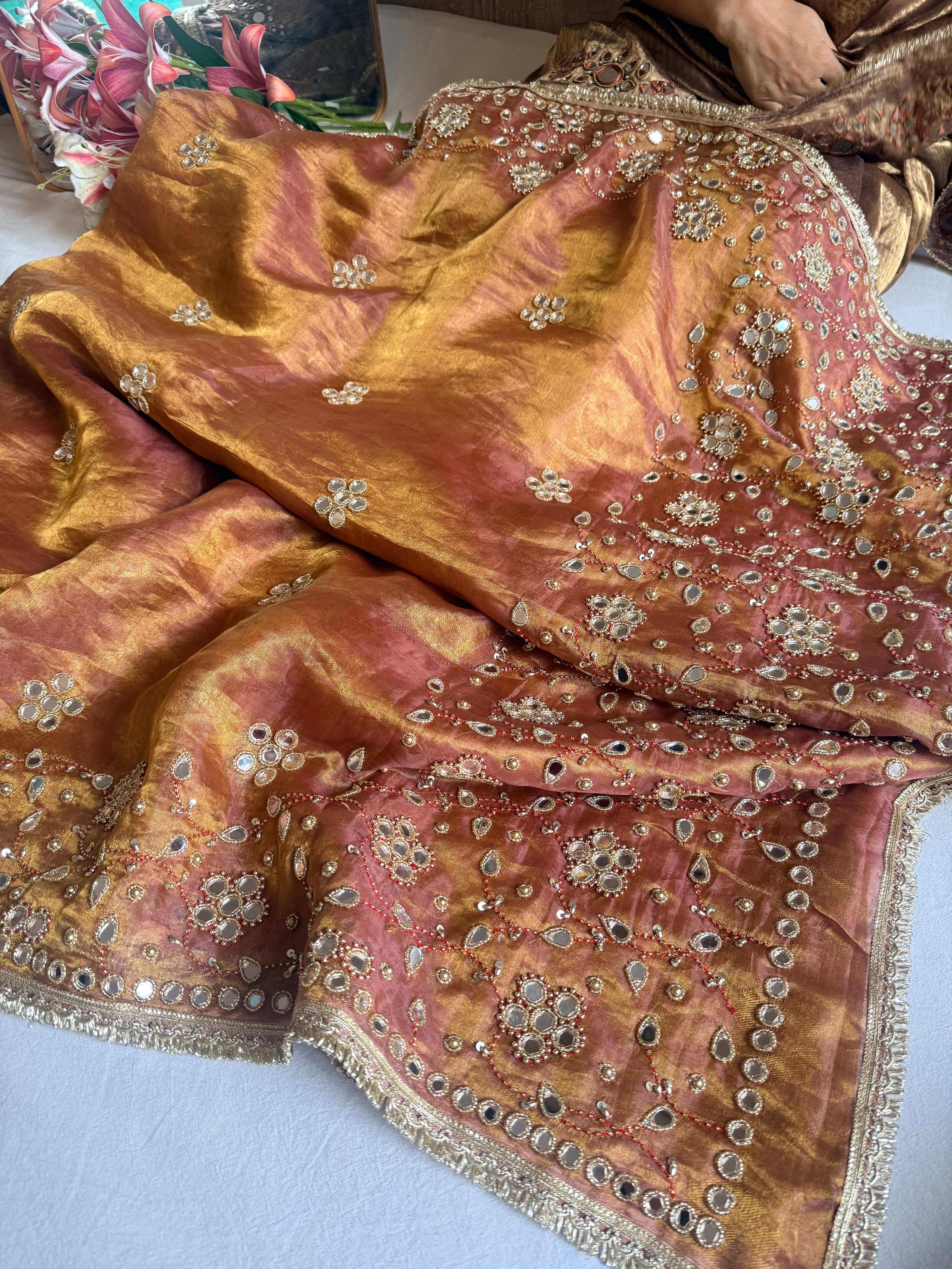 Molten pink tissue silk mirrorwork hand embroidered saree