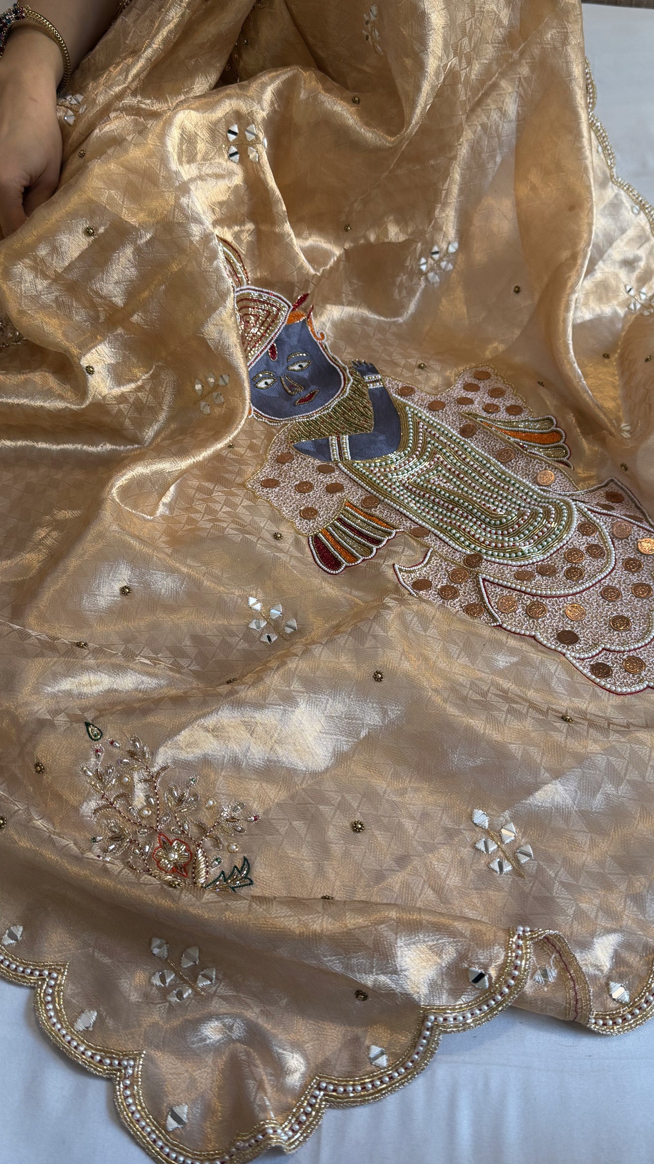 Shrinathji motif inspired molten tissue brocade kadhwa weaving hand embroidered saree