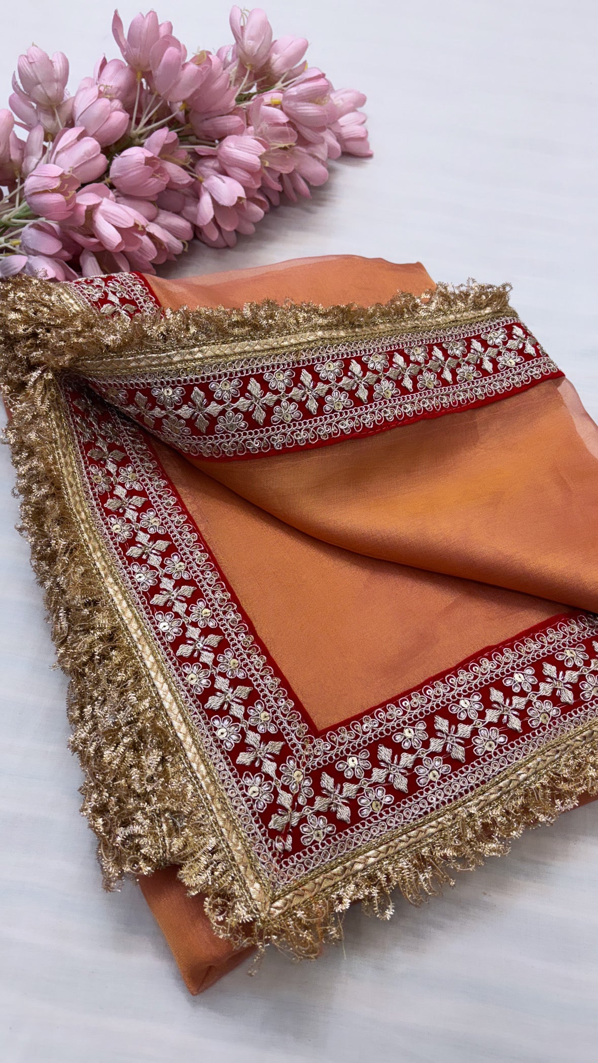 Noor coral orange tissue silk saree