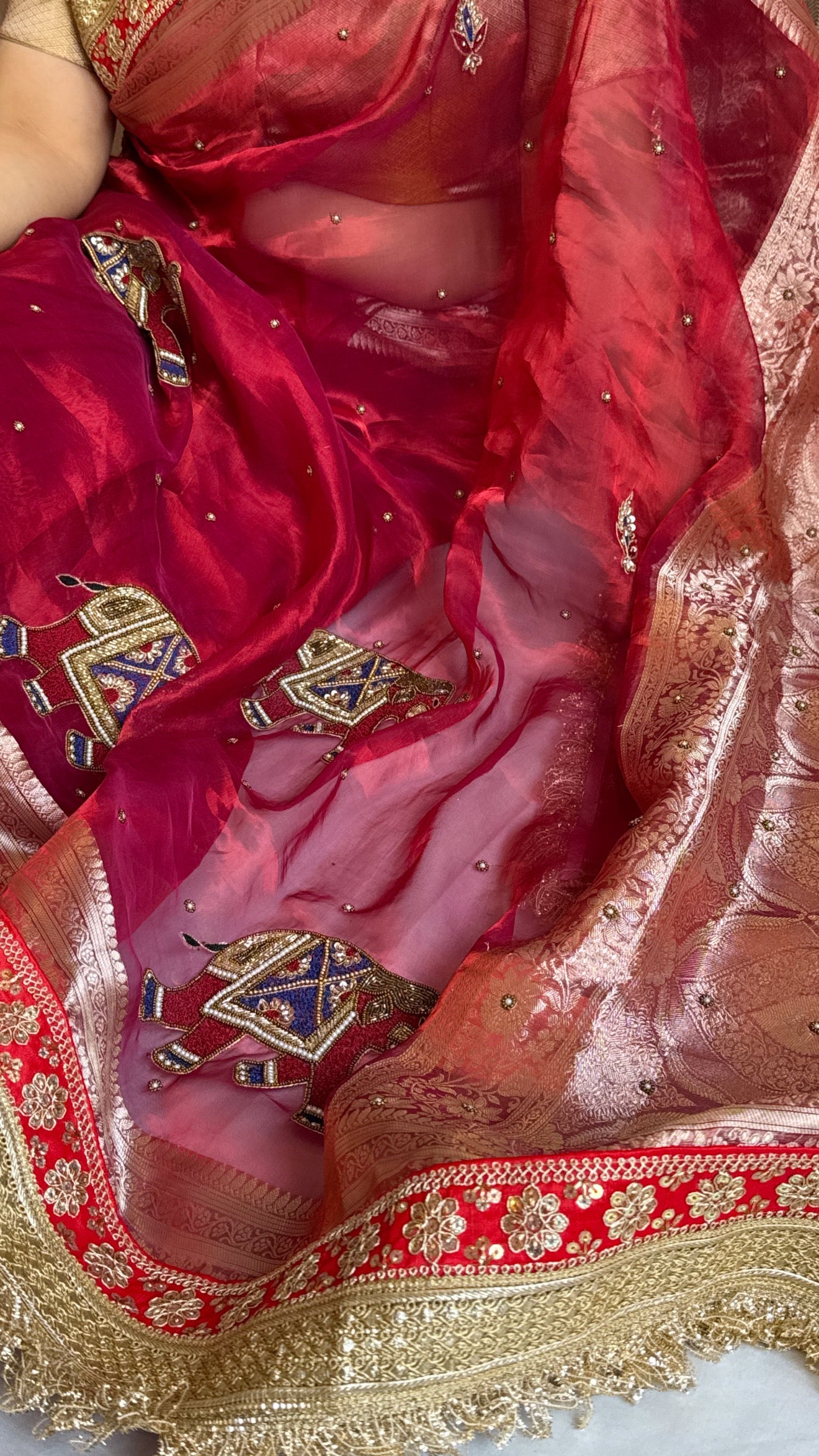 Elephant motif cranberry metallic red husn tissue silk hand embroidered saree