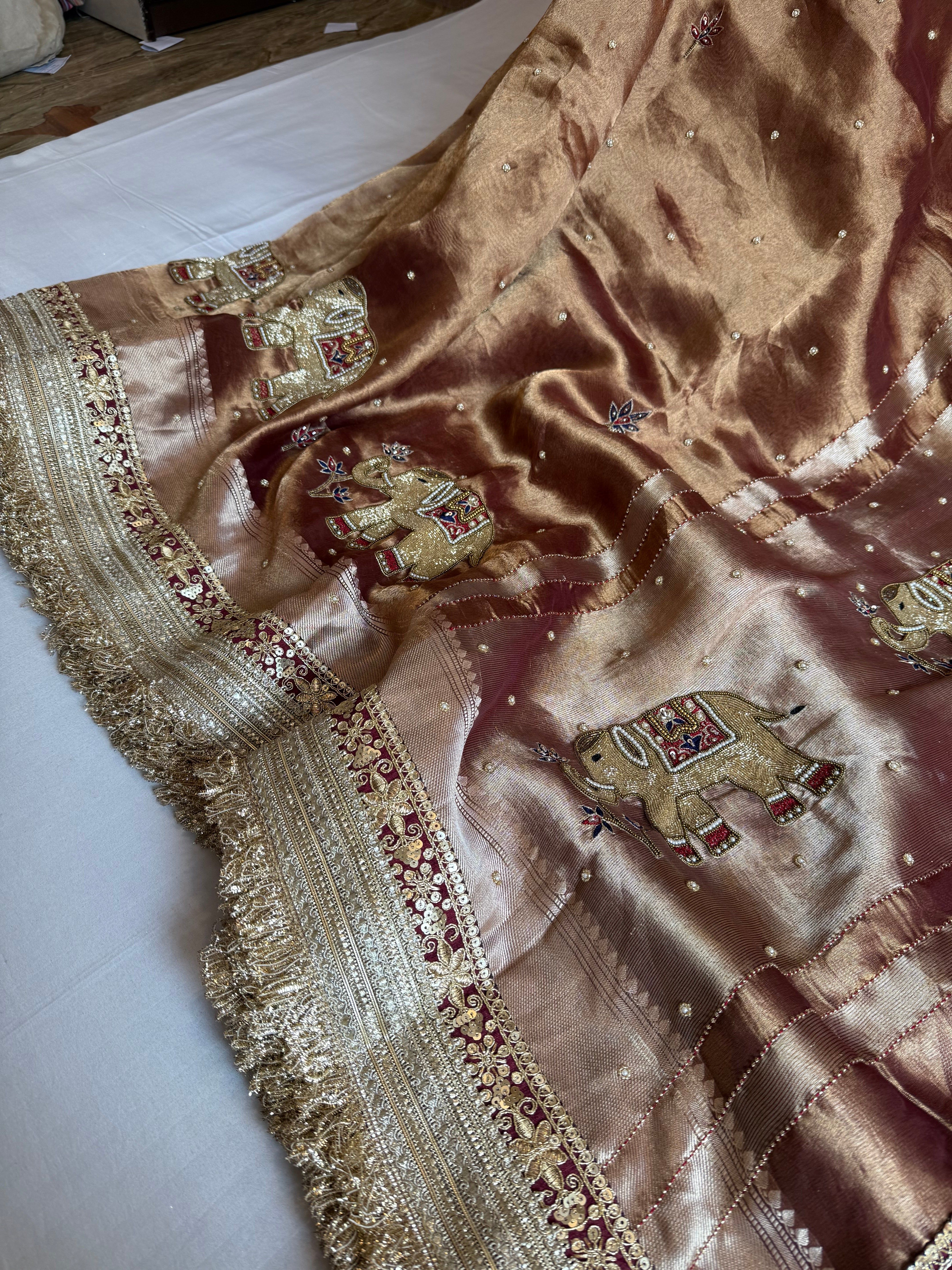 Elephant motif brown tissue silk hand embroidered husn saree