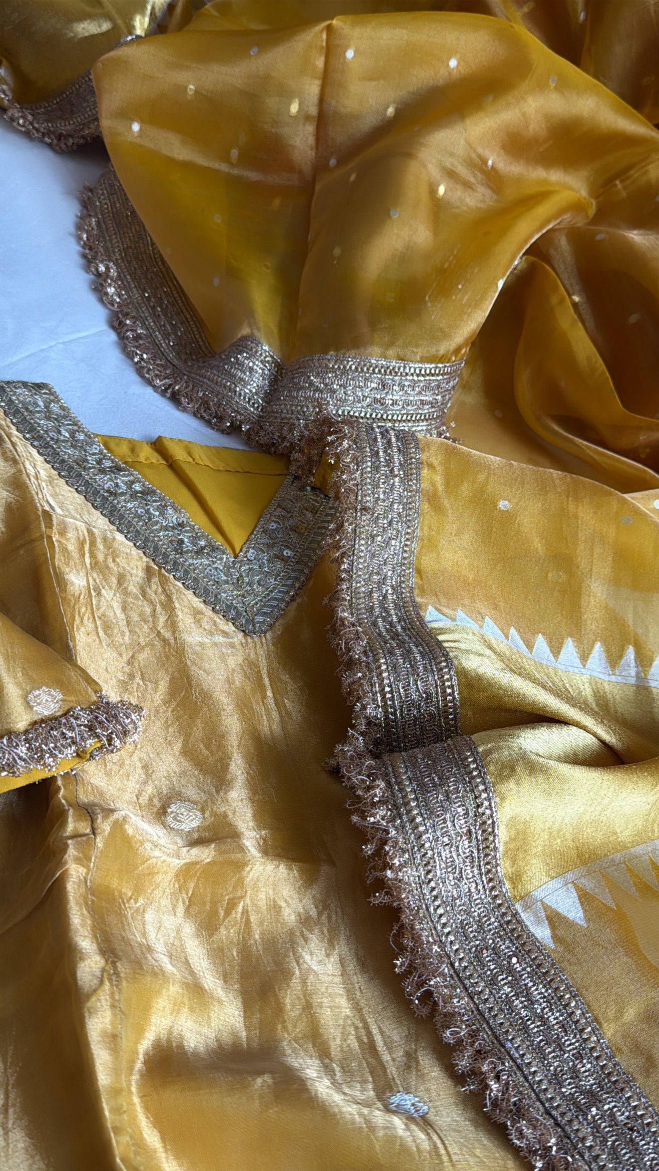 Haldi yellow tissue silk hand embroidered heeramandi semi stitched suit set