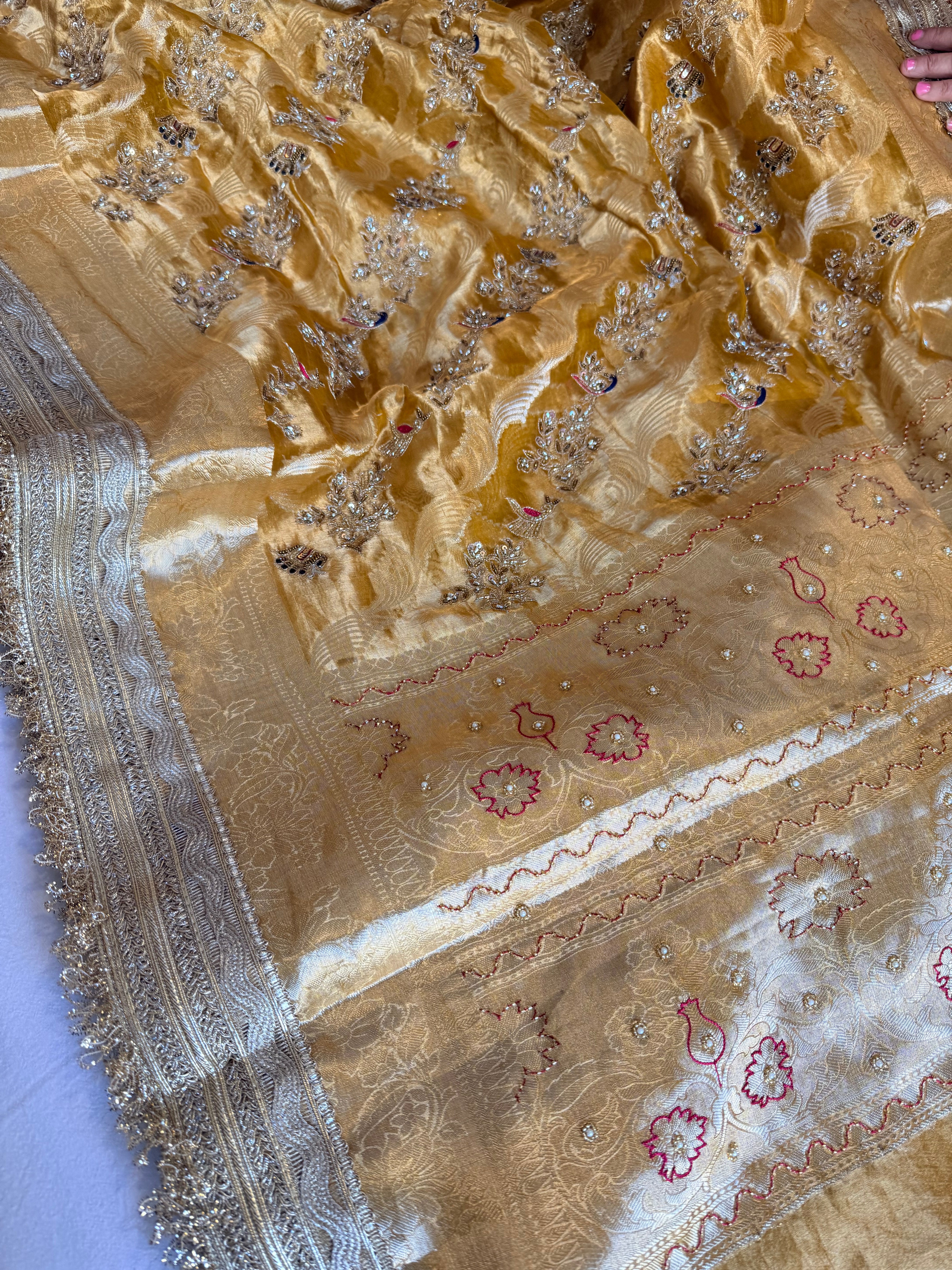 Haldi yellow tissue silk shikargah motif hand embroidered kadhwa saree