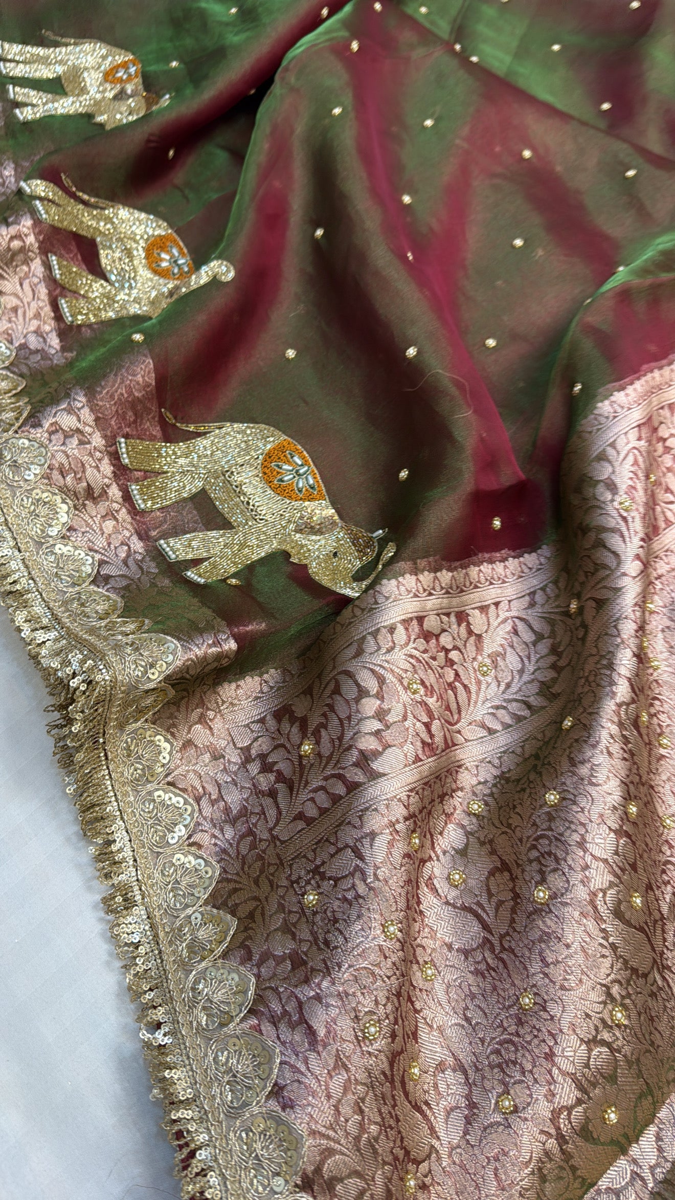 Mehendi green dhup chao effect tissue silk hand embroidered elephant motif saree