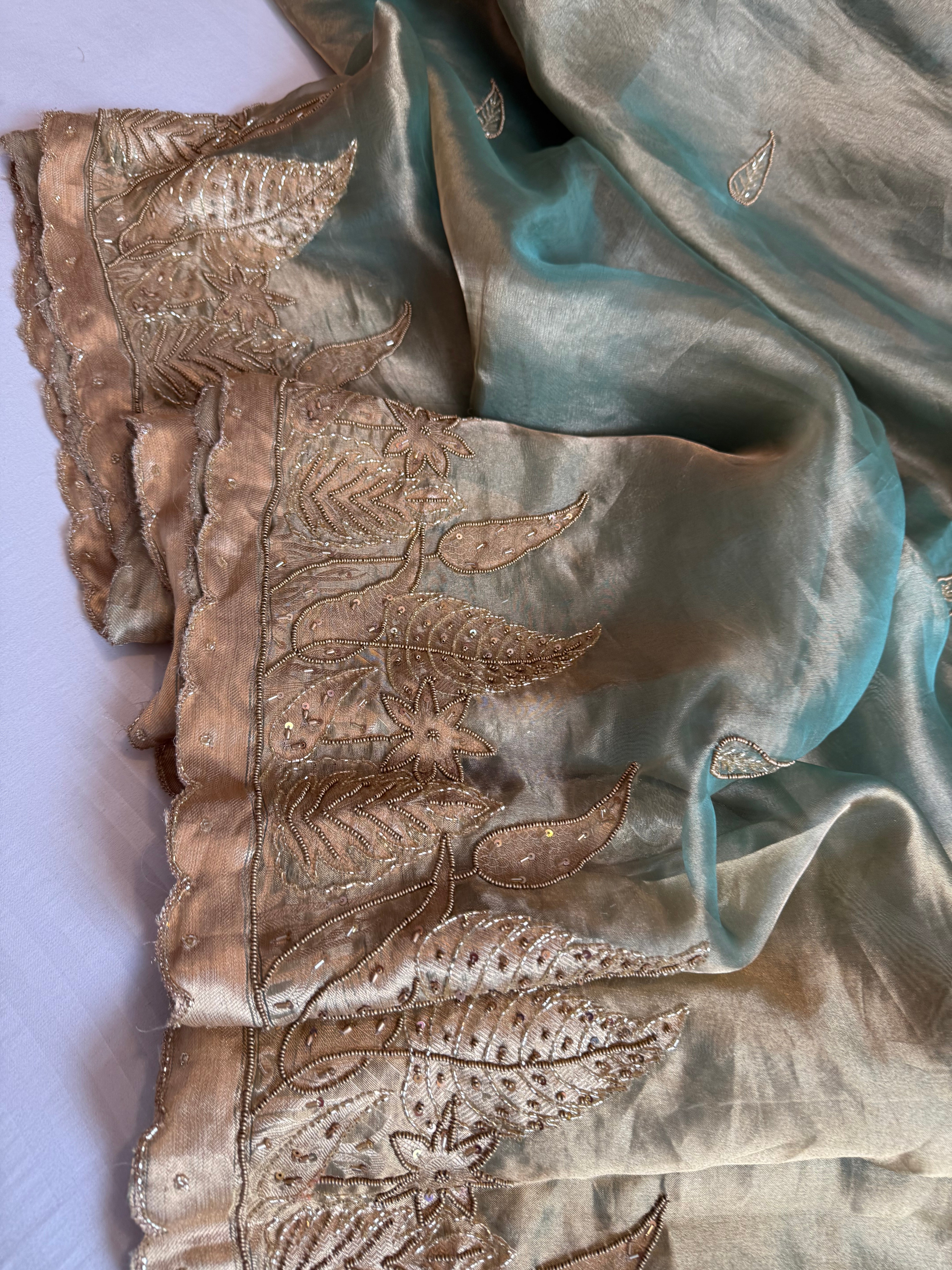 Husn candy green tissue silk heavy hand embroidered saree