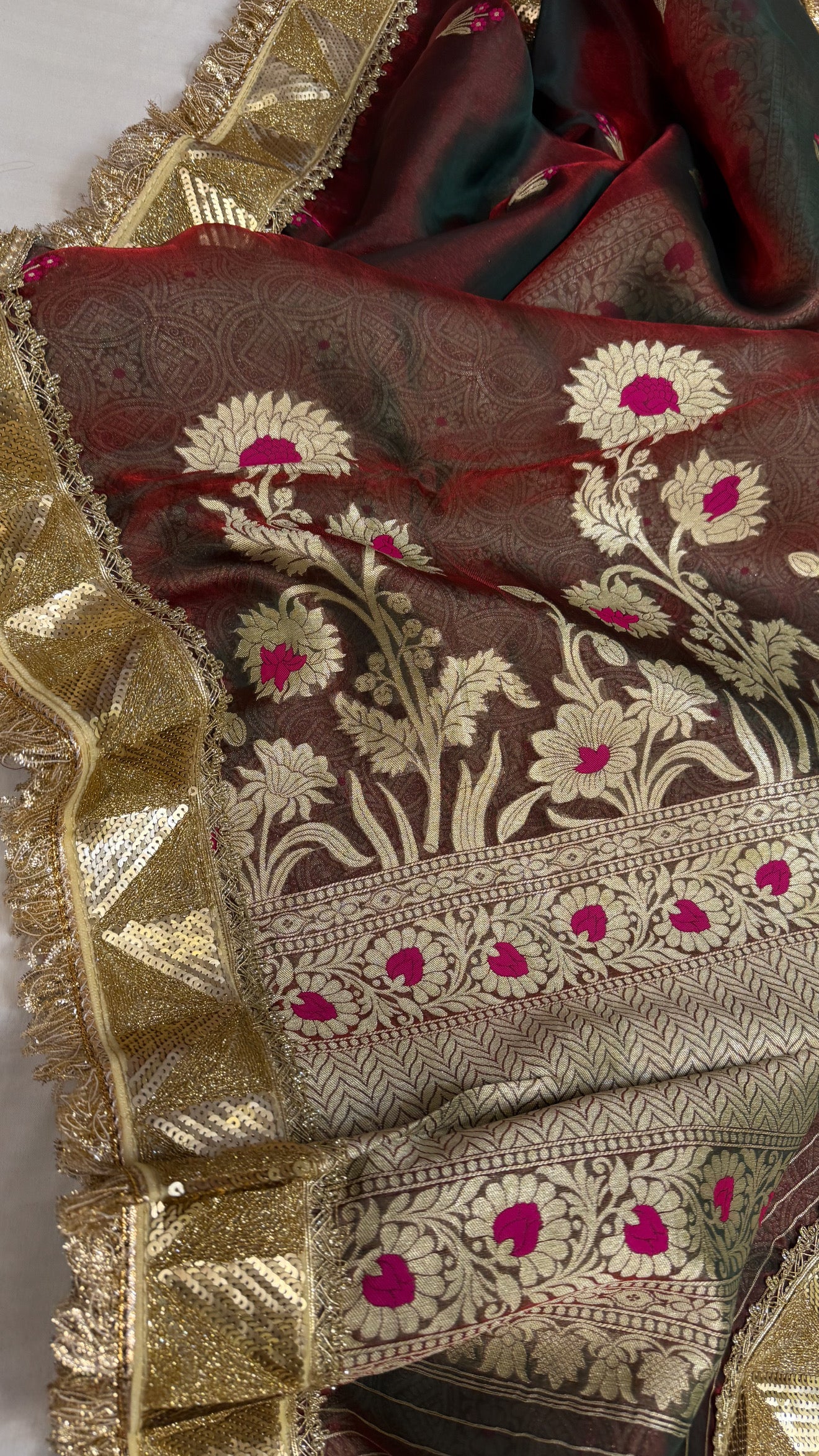 Maharani blood red dhup chao effect tissue silk meenakari saree