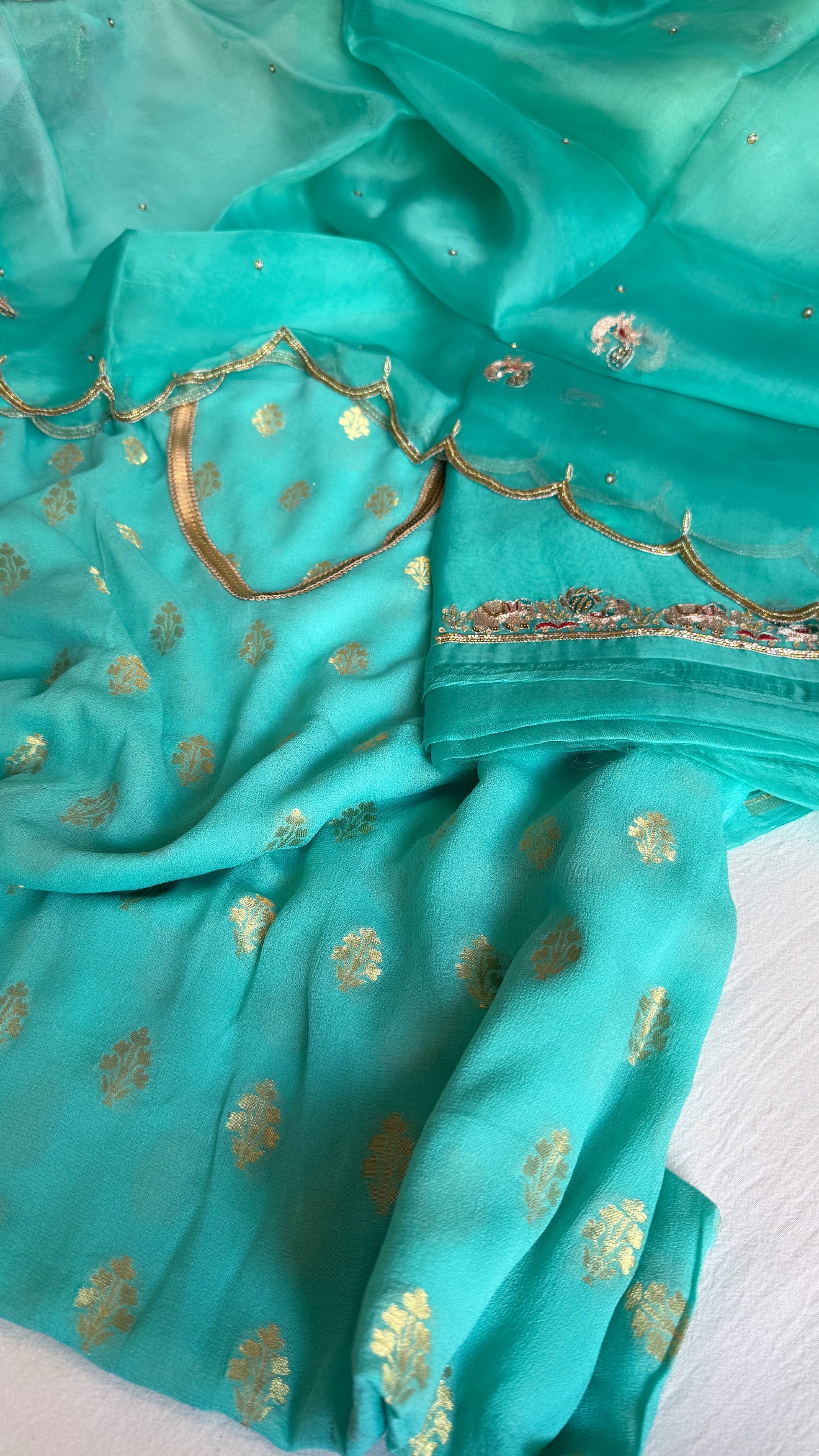 Rama blue banarasi gorgette kadhwa buti kurta paired with toy hathi motif hand embroidered scalloped duppata