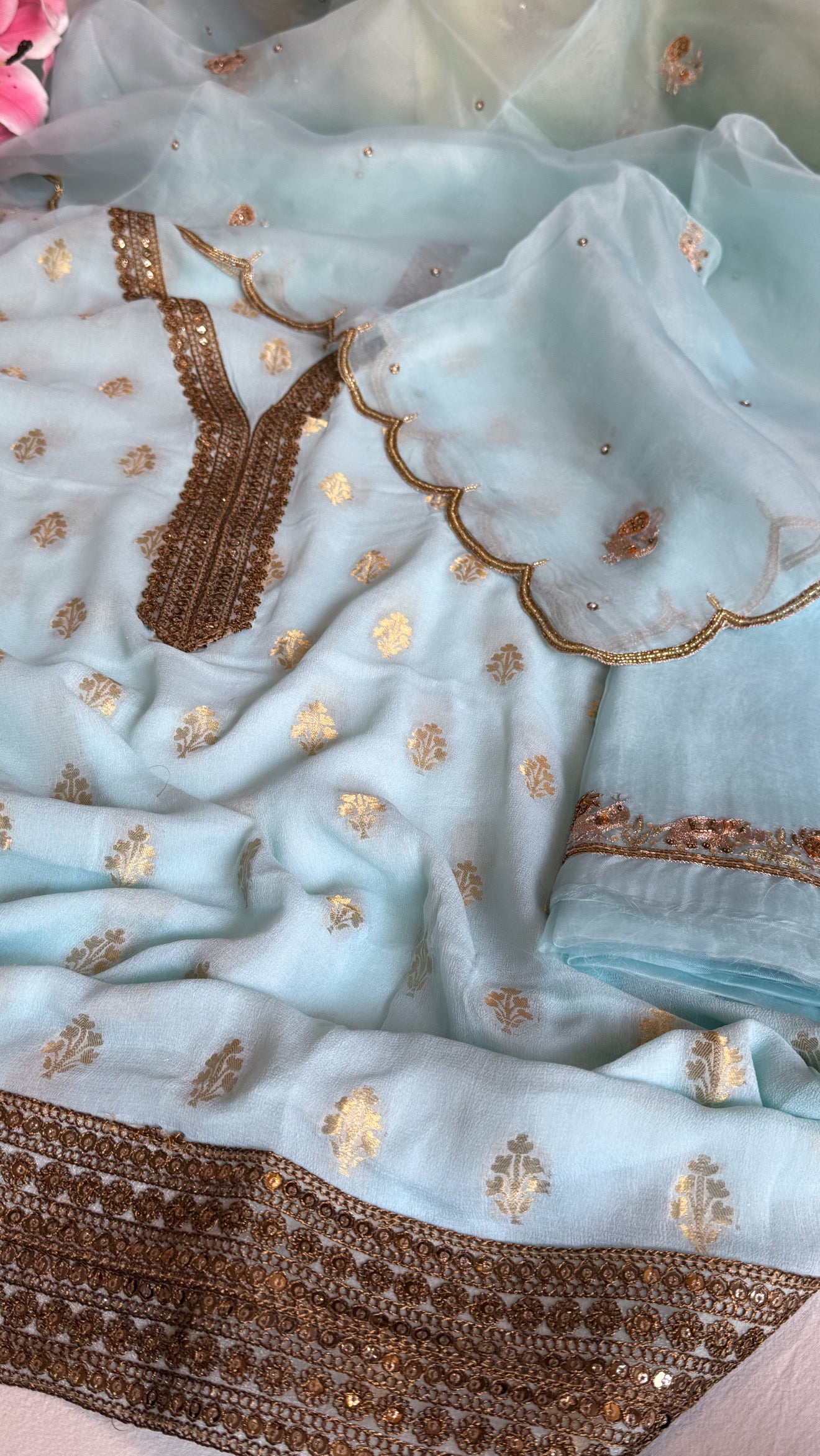 Ice blue banarasi gorgette kadhwa buti kurta paired with toy hathi motif hand embroidered kora duppata