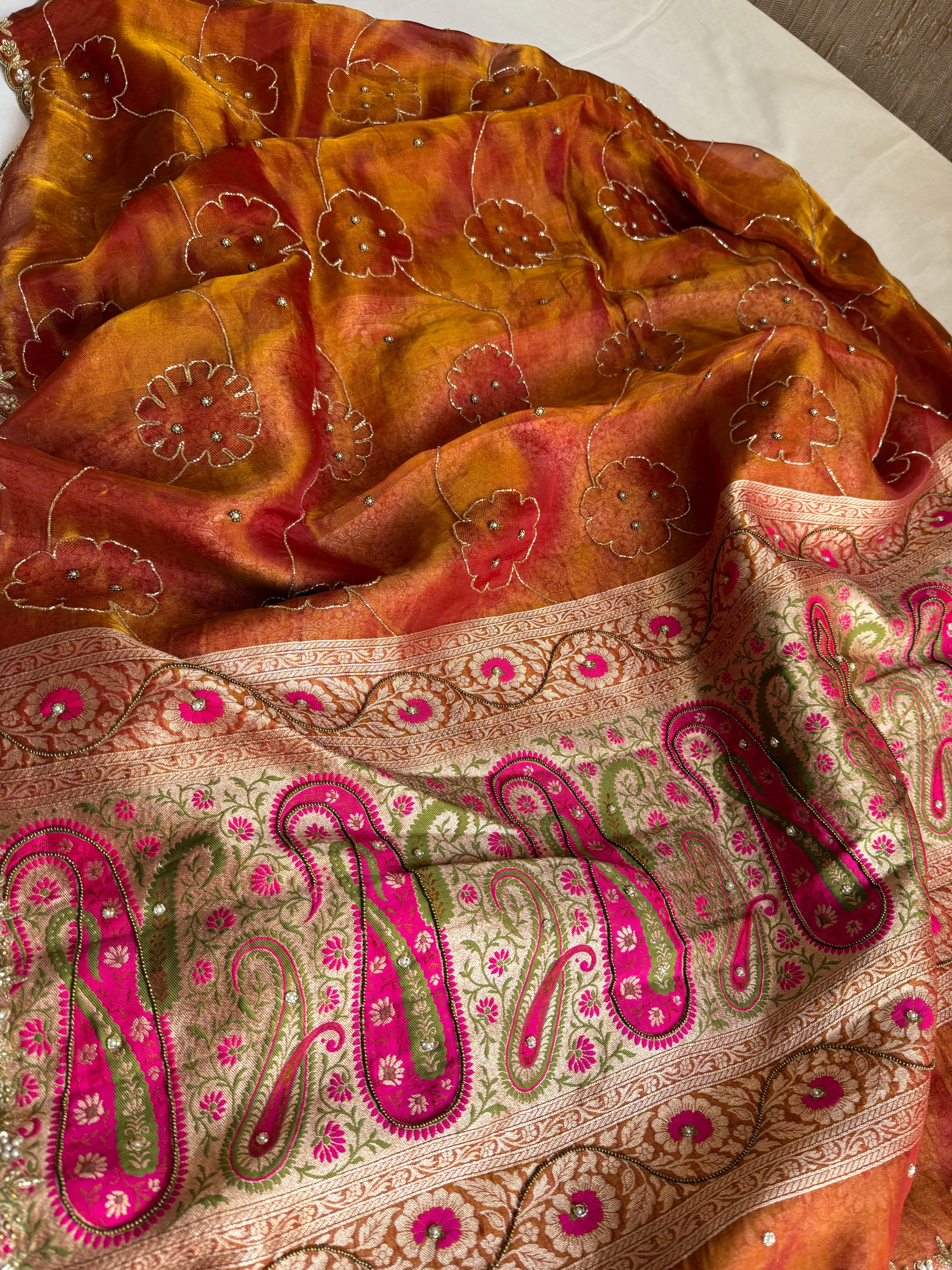 Rust orange tissue tanchoi jamevar pallu meenakari work hand embroidered saree