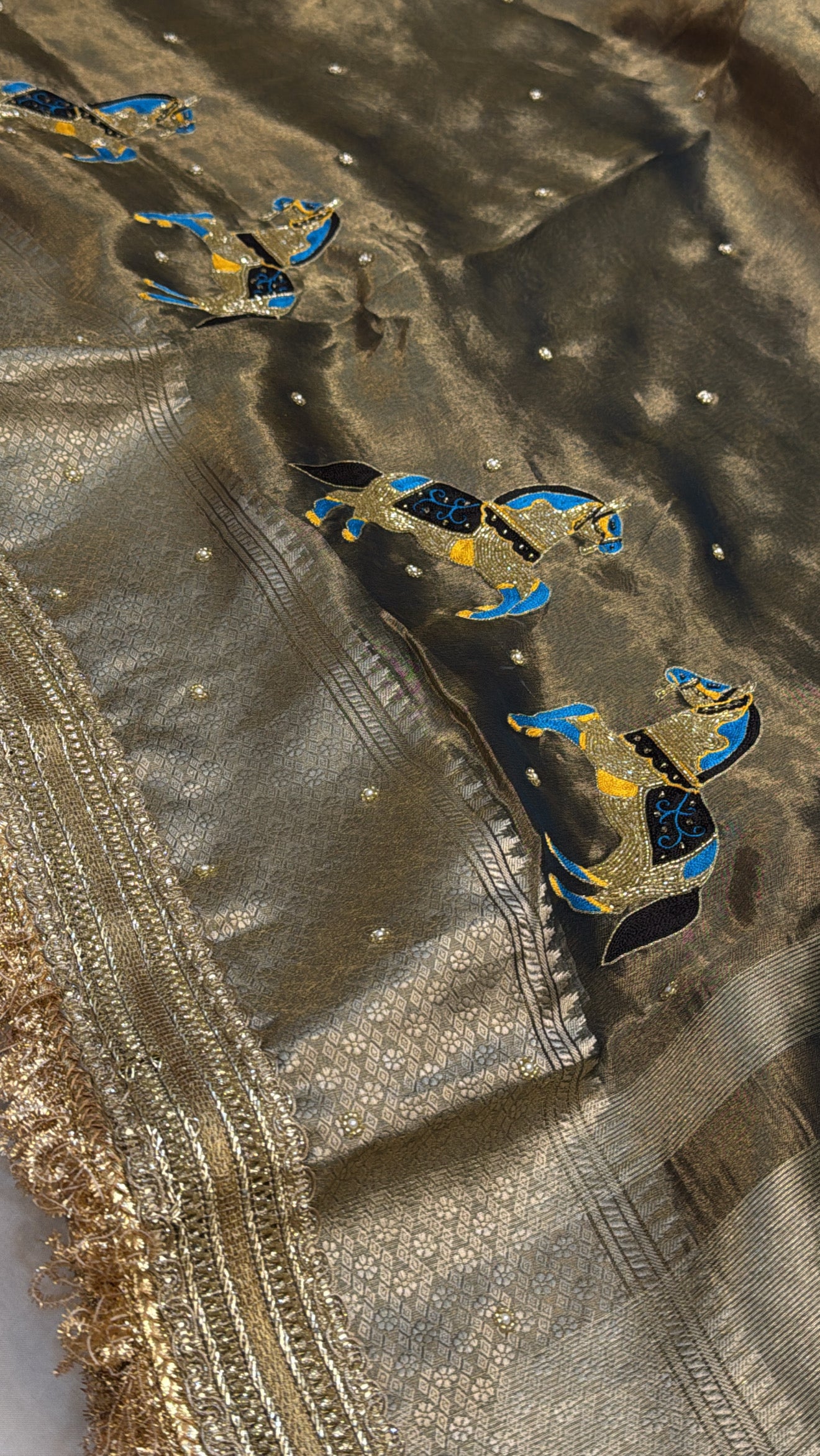 Molten charcoal gold tissue silk horse motif hand embroidered kadhwa saree