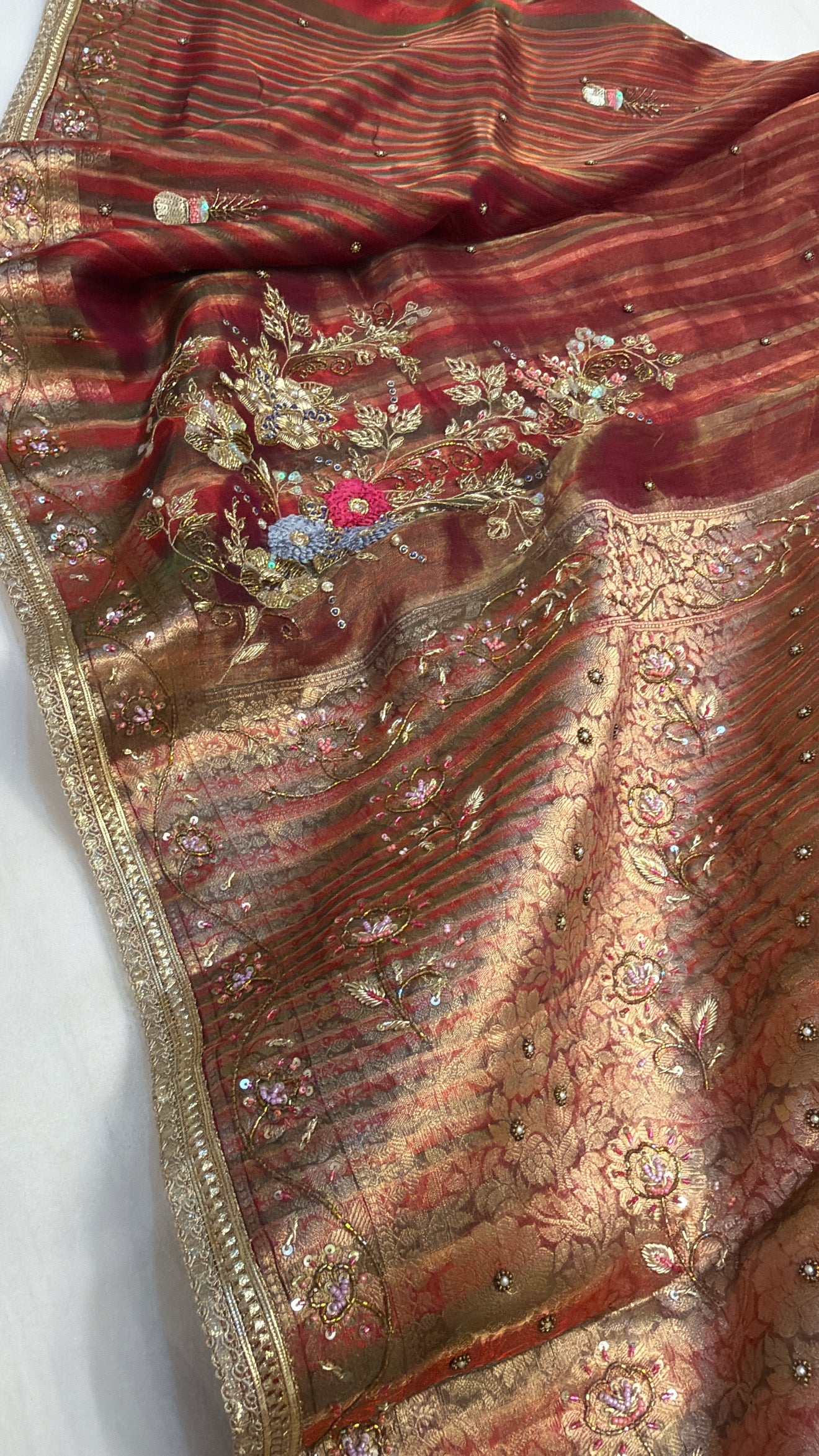 Husn tissue silk multicoloured striped kadhwa hand embroidered saree