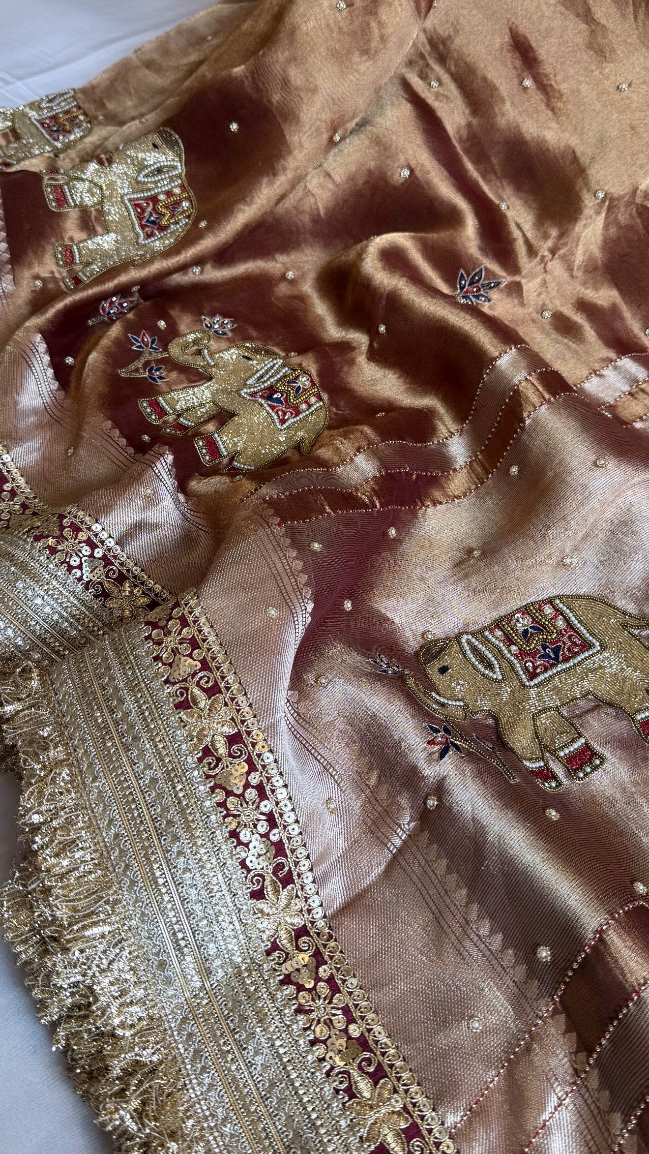 Elephant motif brown tissue silk hand embroidered husn saree