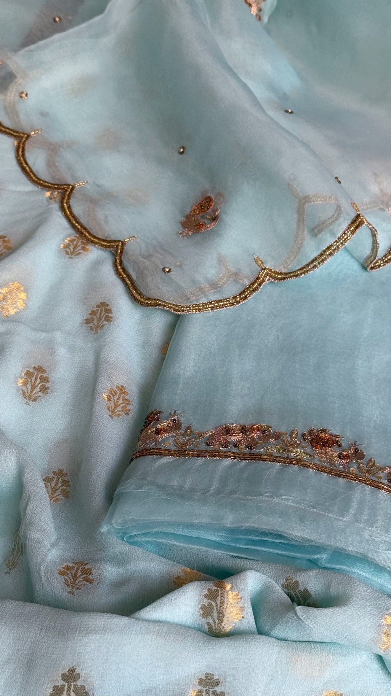 Ice blue banarasi gorgette kadhwa buti kurta paired with toy hathi motif hand embroidered kora duppata