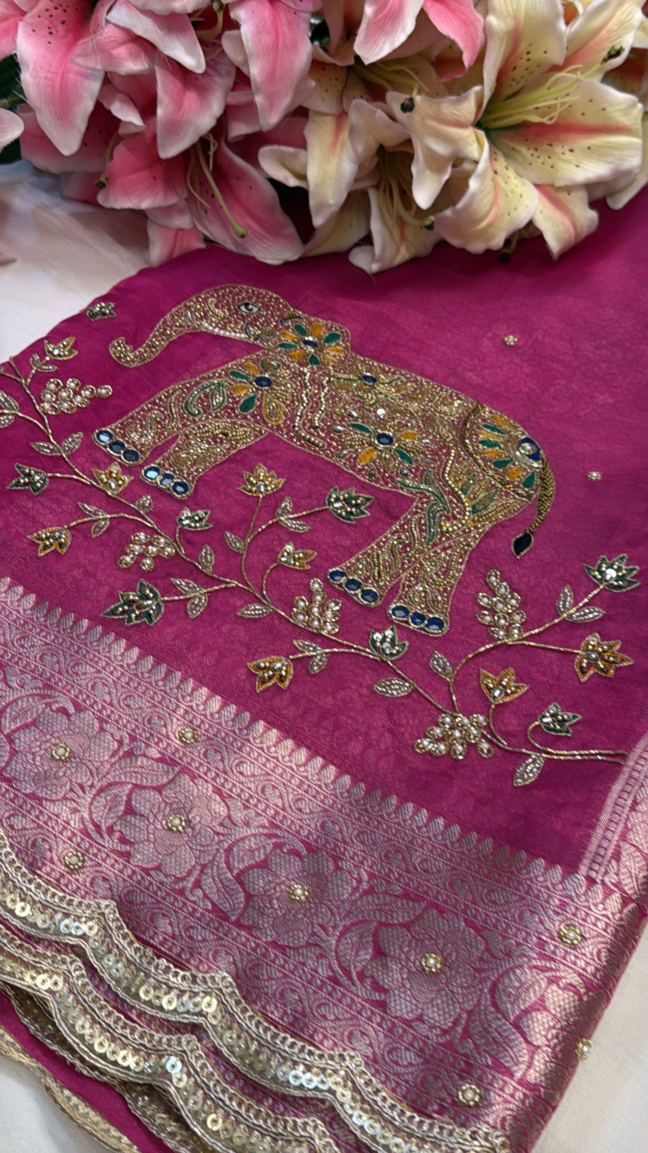 Rani pink husn tissue silk elephant motif hand embroidered saree