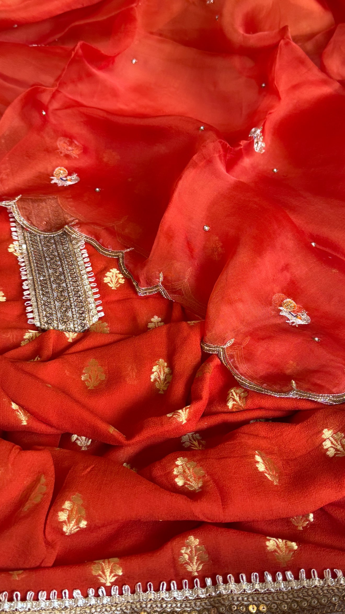 Burnt orange banarasi gorgette kadhwa buti kurta paired with toy hathi motif hand embroidered scalloped kora duppata