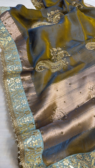Husn dusty metallic blue tissue silk hand embroidered saree